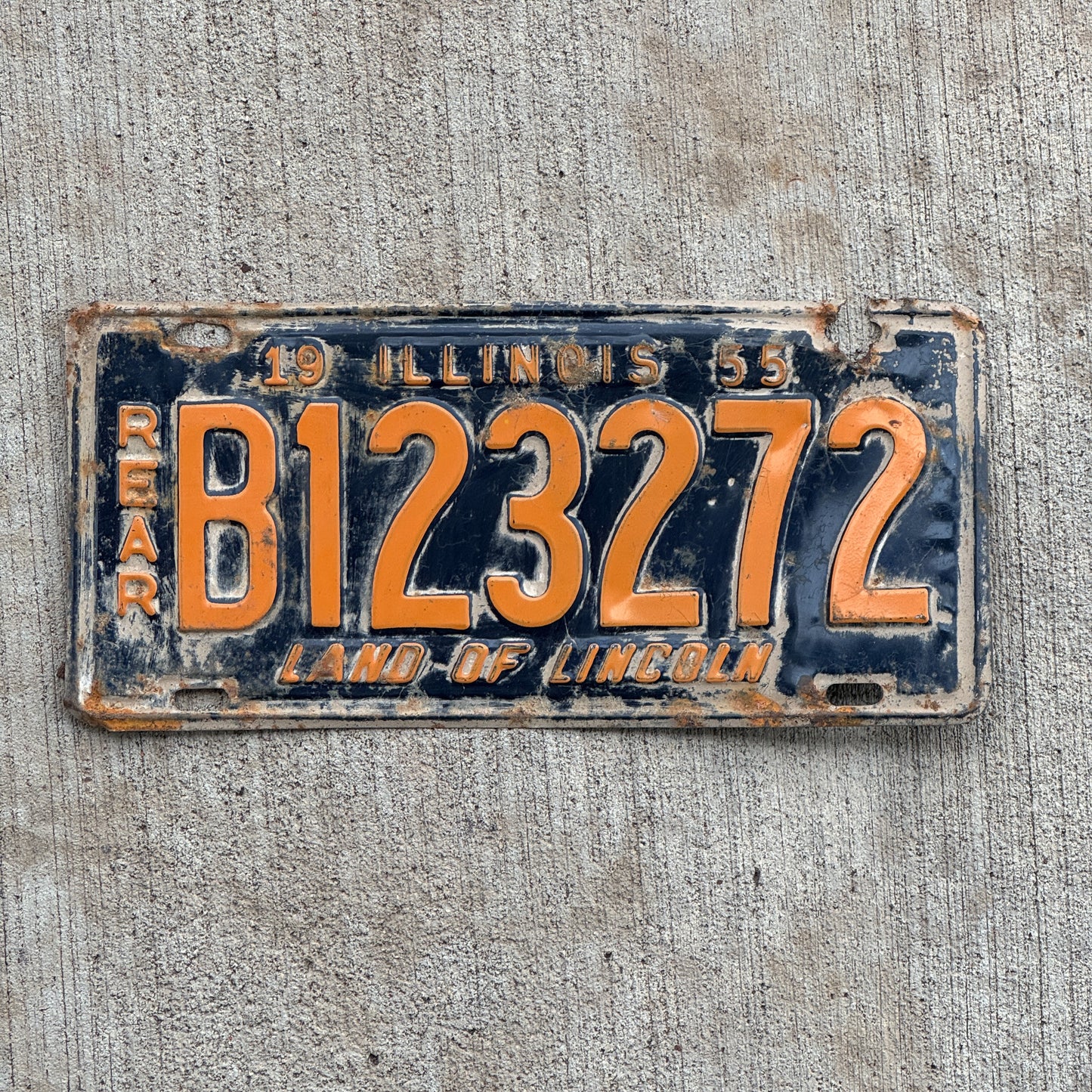 Photo of a 1955 Illinois Truck License Plate Auto Tag Garage Decor Vintage Front Plate Orange Blue B 123 272 with original patina