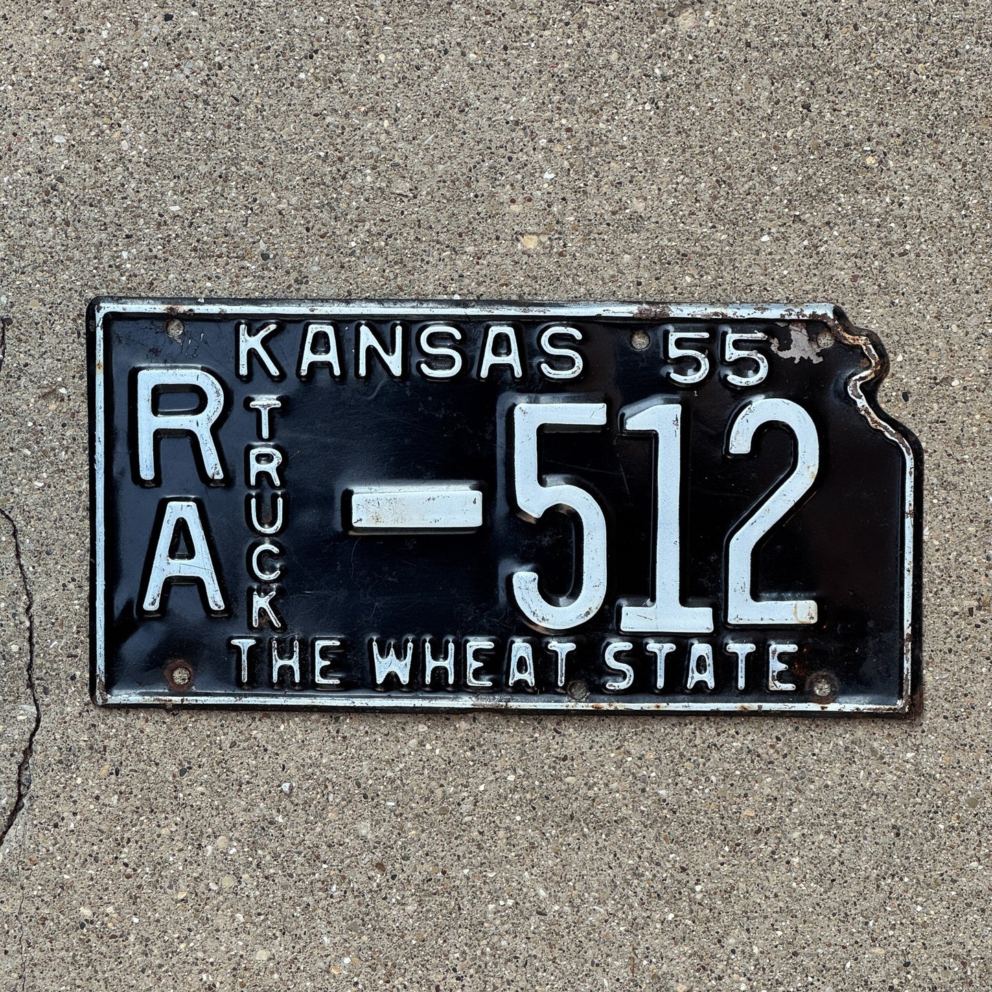 Photo of a 1955 Kansas Truck License Plate Auto Tag Garage Decor Vintage Rawlins County State Shape RA 512