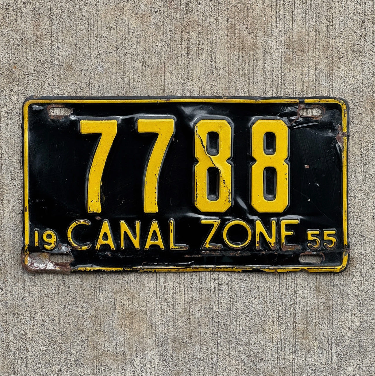Photo of a 1955 Panama Canal Zone License Plate Auto Tag Garage Decor Vintage 7788 with original patina