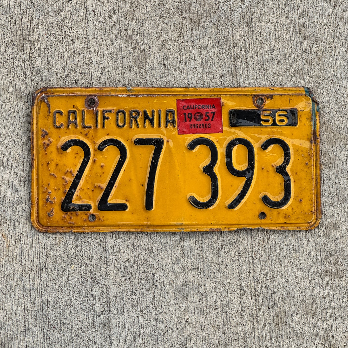 Photo of a 1956 1957 California Trailer License Plate Auto Tag Garage Decor Vintage Beginning of Serial 200 000 Start 227 393 with original patina