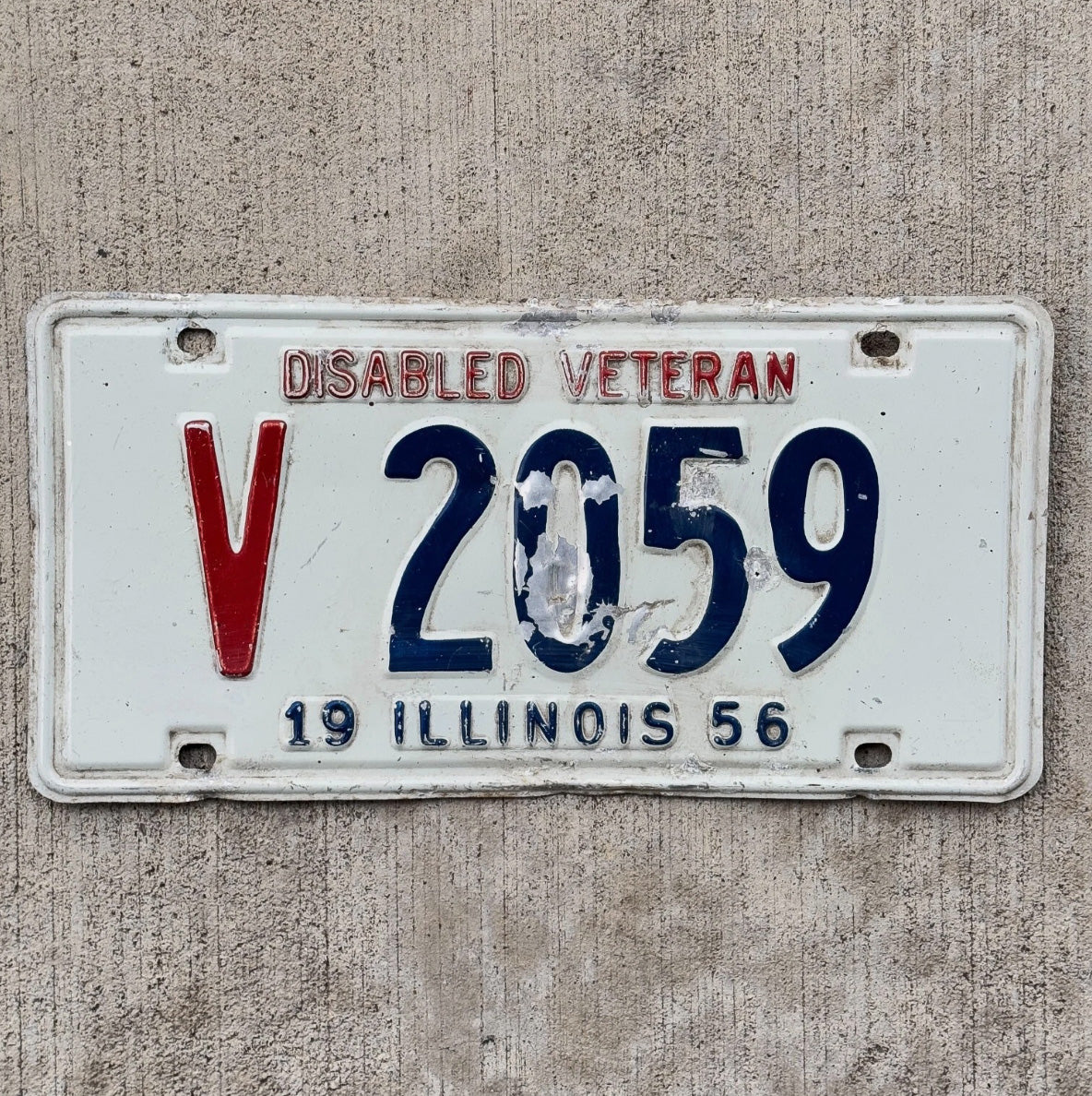 Photo of a 1956 Illinois Disabled Veteran License Plate Auto Tag 2 Garage Decor DAV V 2059
