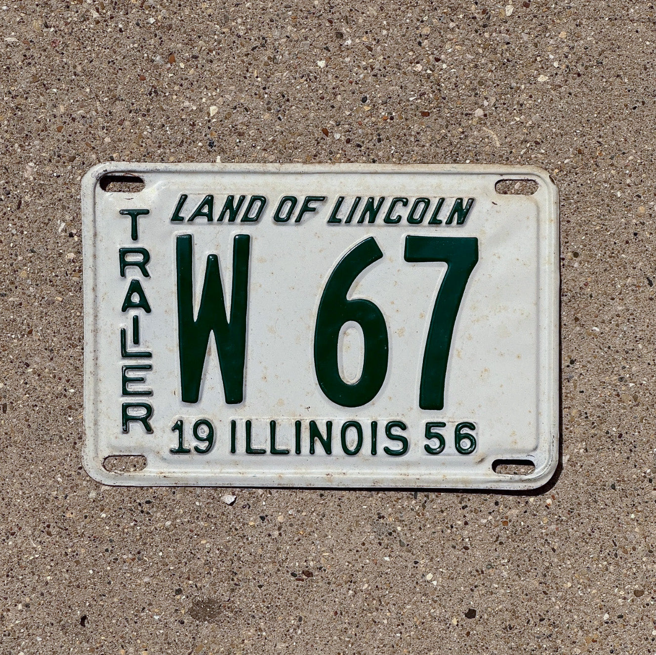 Photo of a 1956 Illinois Trailer License Plate Auto Tag Garage Decor Vintage Low Number Two Digit W 67 with original patina