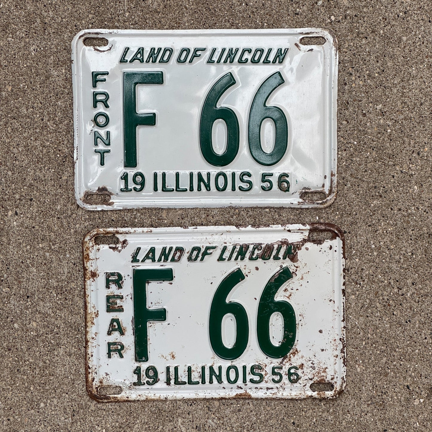 Photo of a 1956 Illinois Truck License Plate Pair Auto Tag Garage Decor Vintage Low Number Two Digit F 66 with original patina
