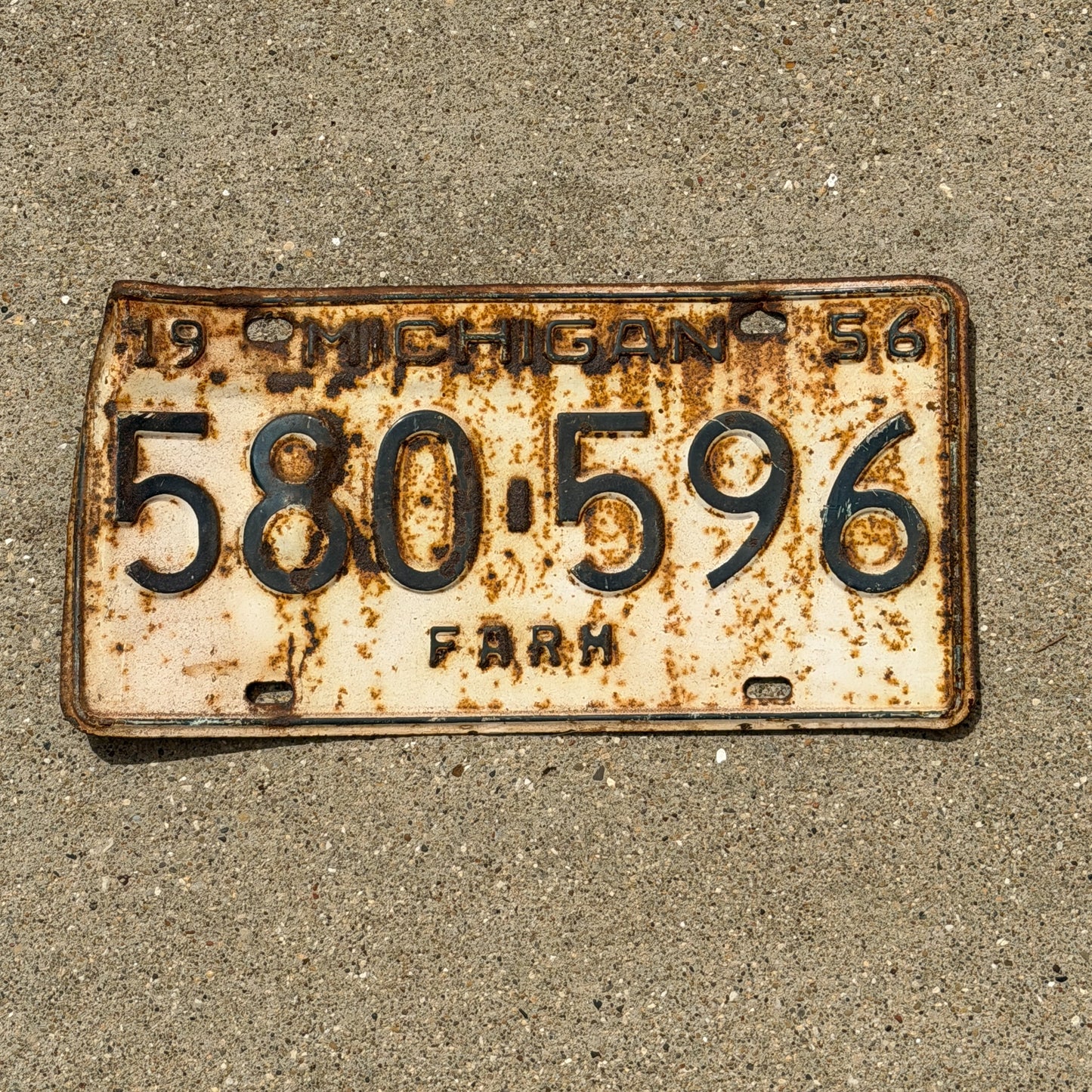 Photo of a 1956 Michigan Farm License Plate Auto Tag Garage Decor Vintage 580 596 with original patina