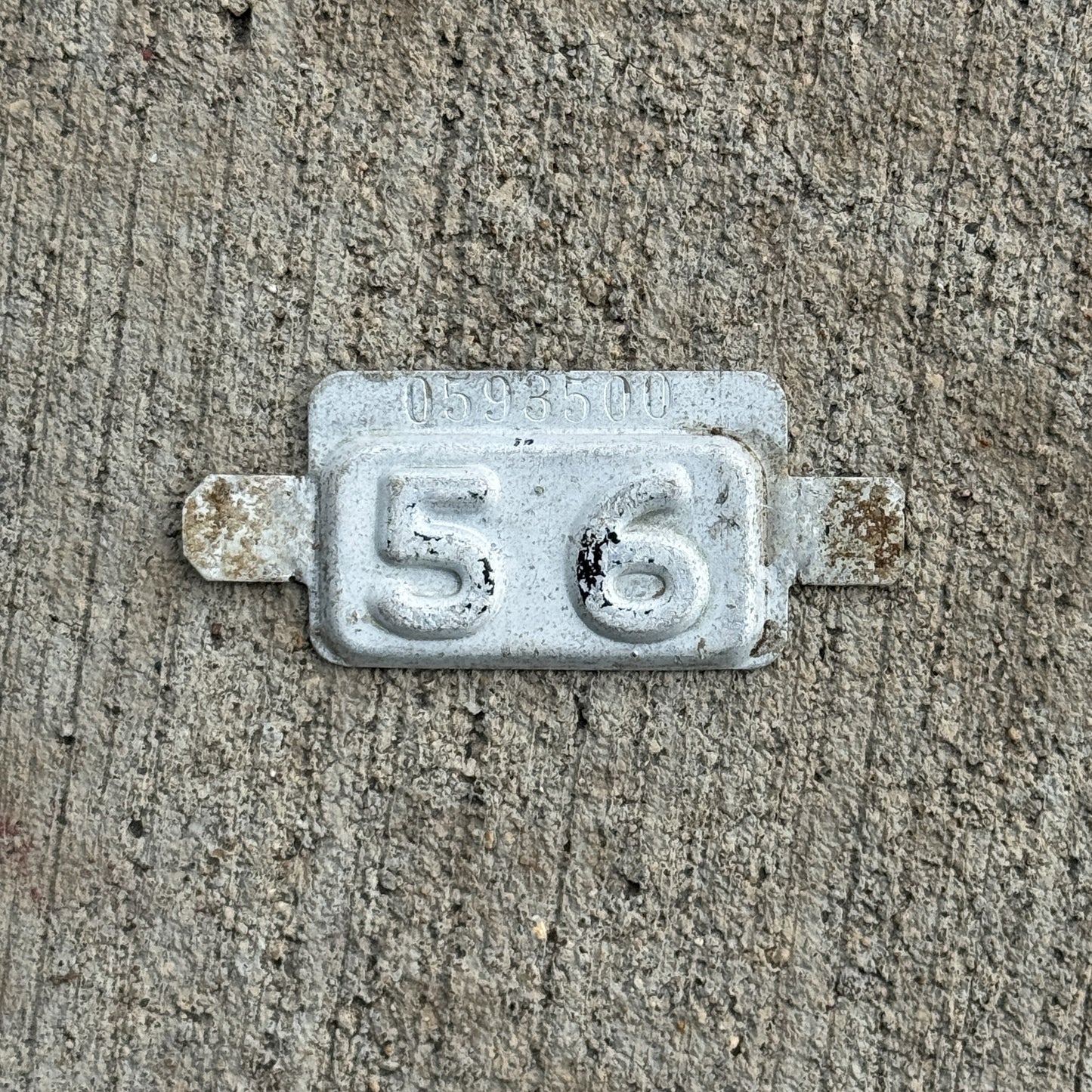Photo of a 1956 New Jersey Tab License Plate Auto Tag 1 Vintage 0593500 with original patina
