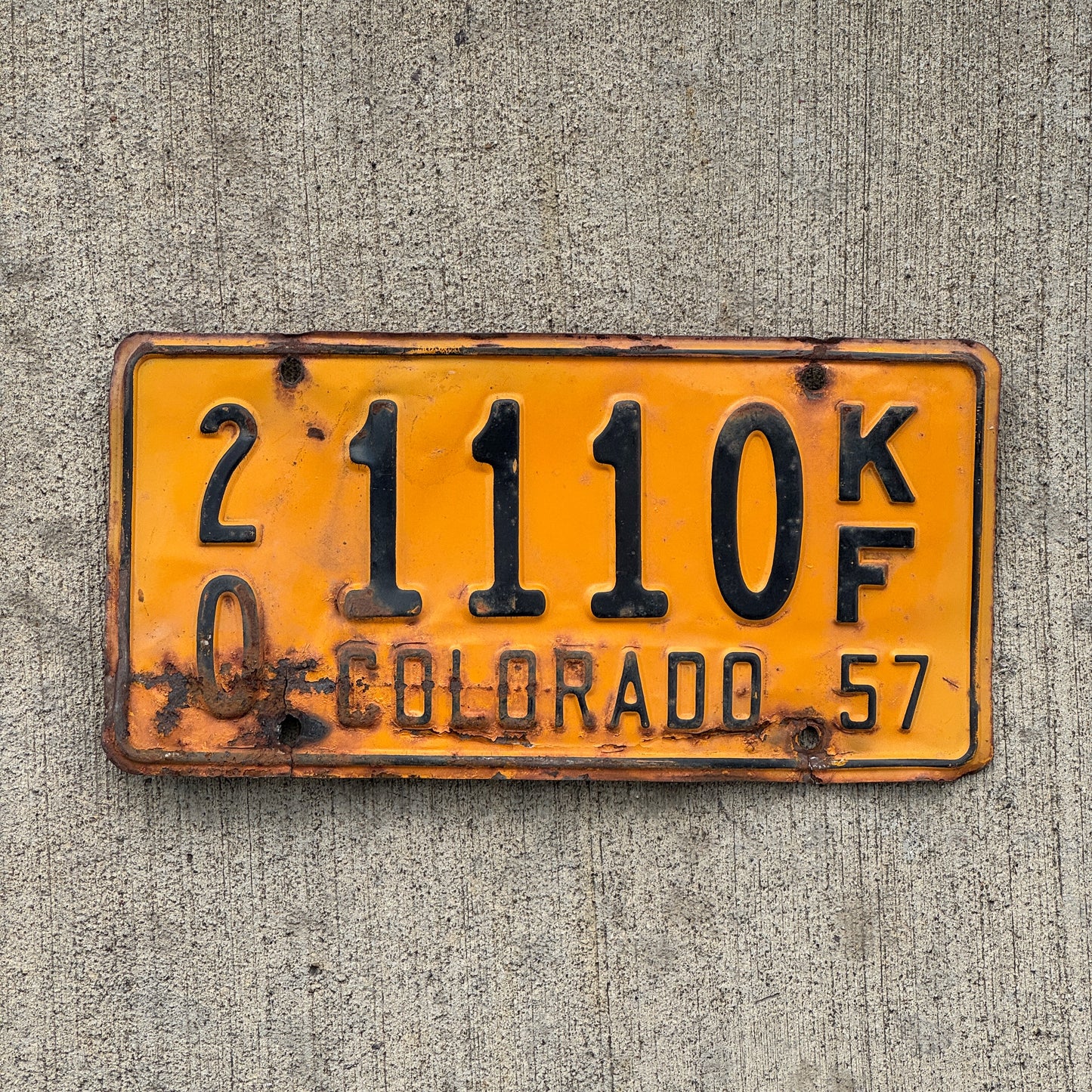 Photo of a 1957 Colorado Farm Truck License Plate Auto Tag Garage Decor Vintage Repeat Repeating 20 1110 KF with original patina