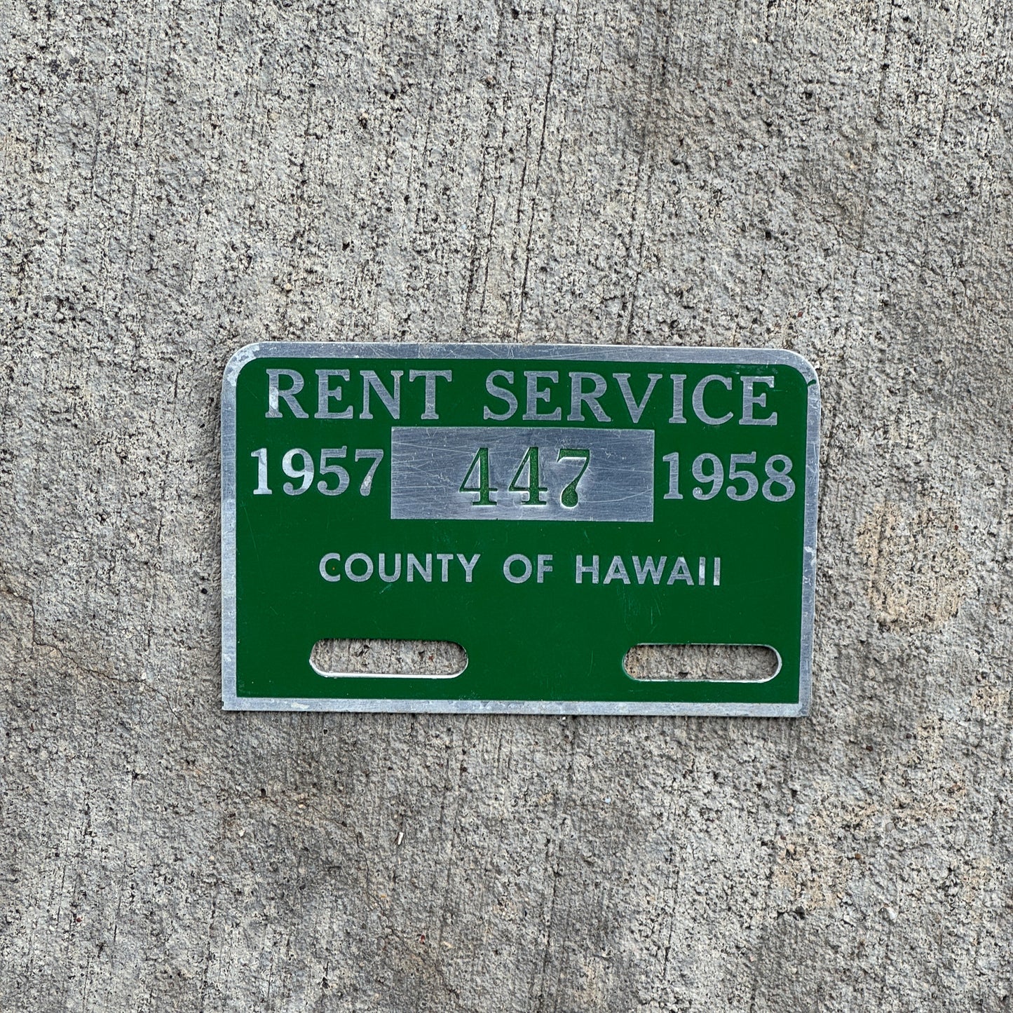 Photo of a 1957 Hawaii Tag Auto Tag Garage Decor Vintage Rent Service 447 with original patina