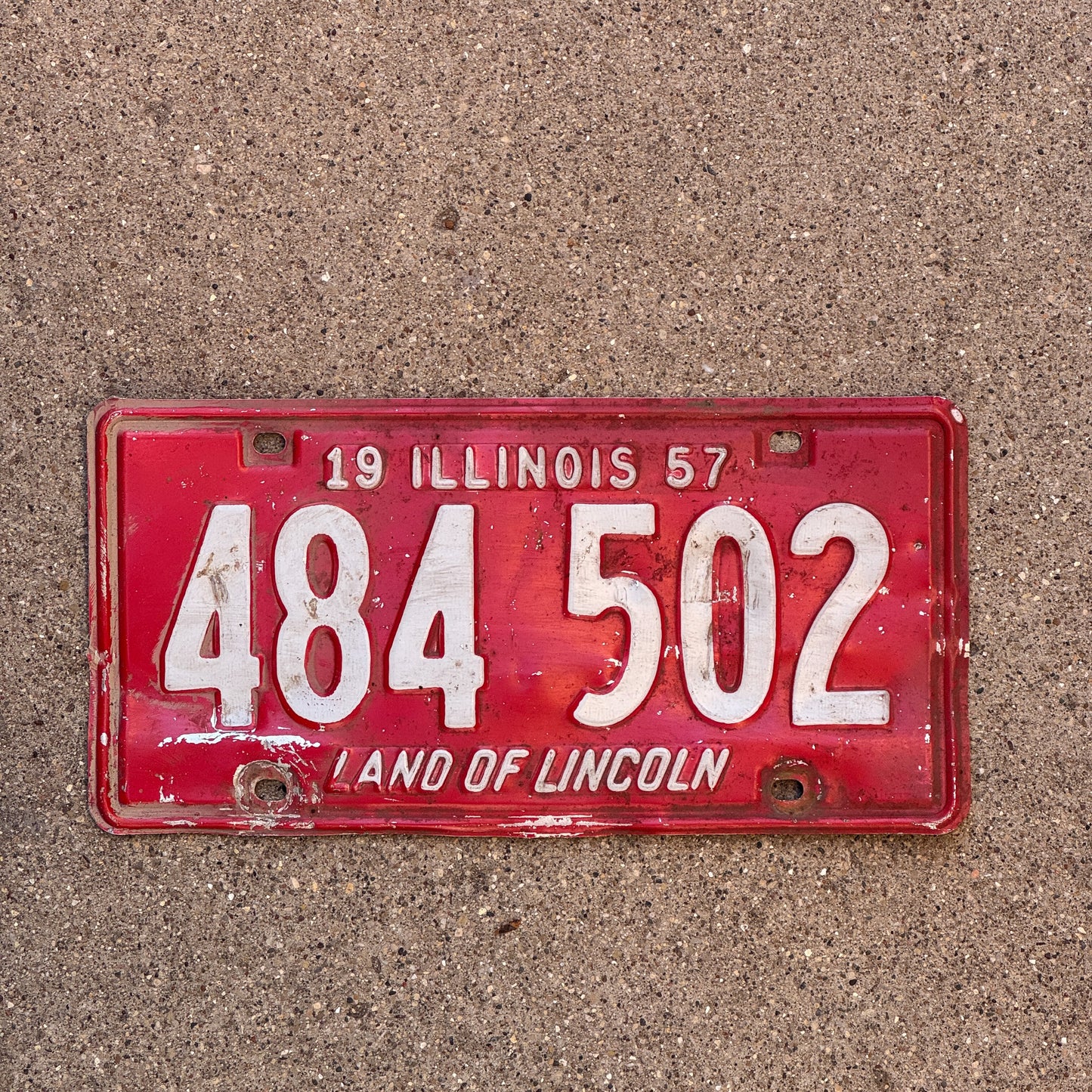 Photo of a 1957 Illinois License Plate Auto Tag Garage Decor Vintage 484 502 with original patina