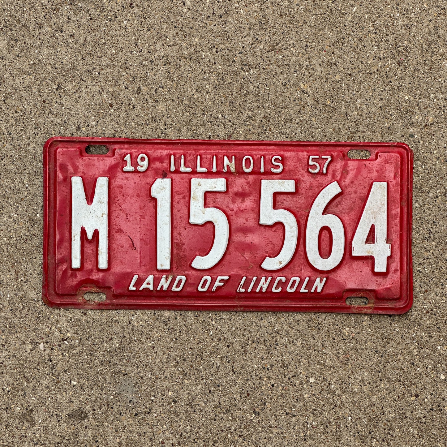 Photo of a 1957 Illinois Municipal License Plate Auto Tag 1 Vintage Garage M 15 564 with original patina