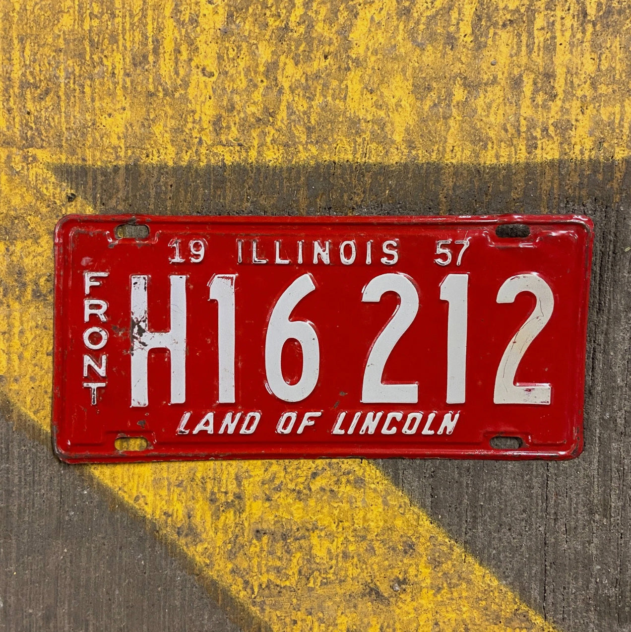 Photo of a 1957 Illinois Truck License Plate Auto Tag Garage Decor Vintage H 16212 with original patina