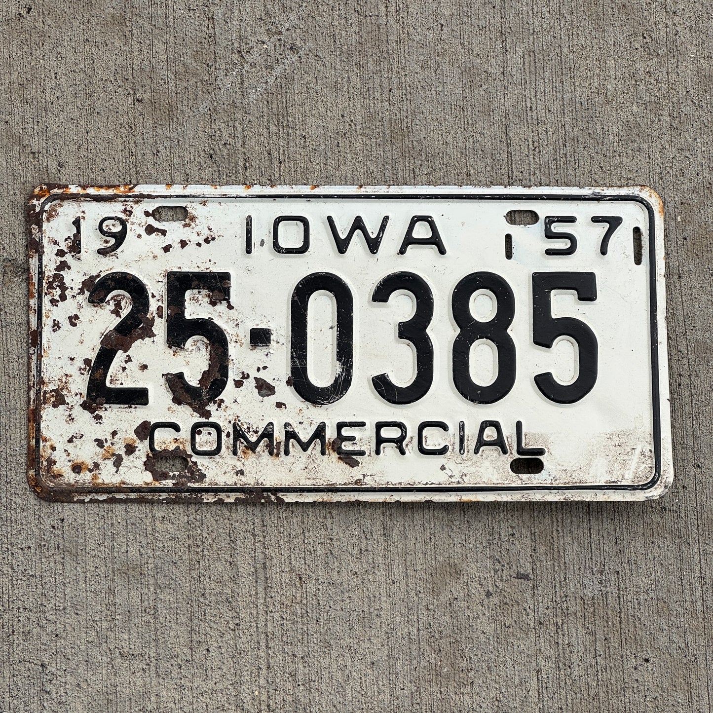 Photo of a 1957 Iowa Commercial License Plate Auto Tag Garage Decor Vintage 25 0385 with original patina