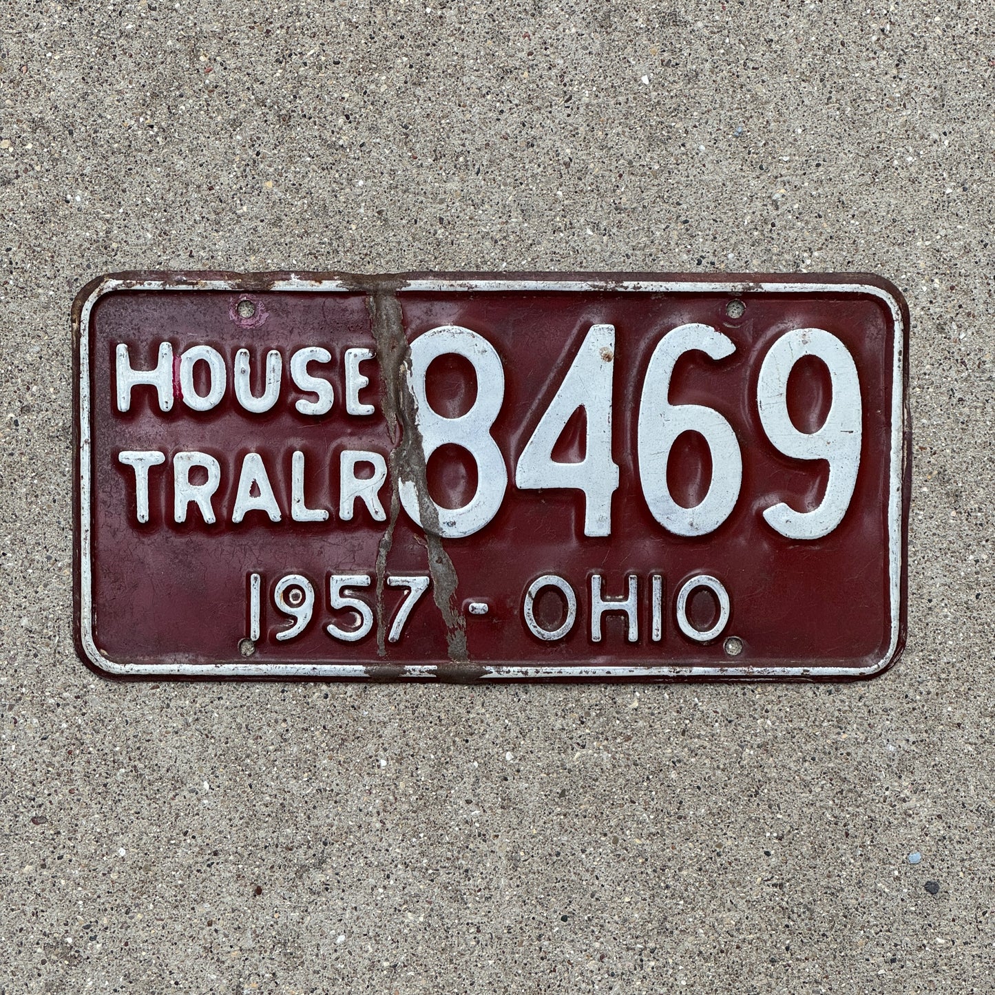 Photo of a 1957 Ohio House Trailer License Plate Auto Tag Garage Decor Vintage 8469 with original patina