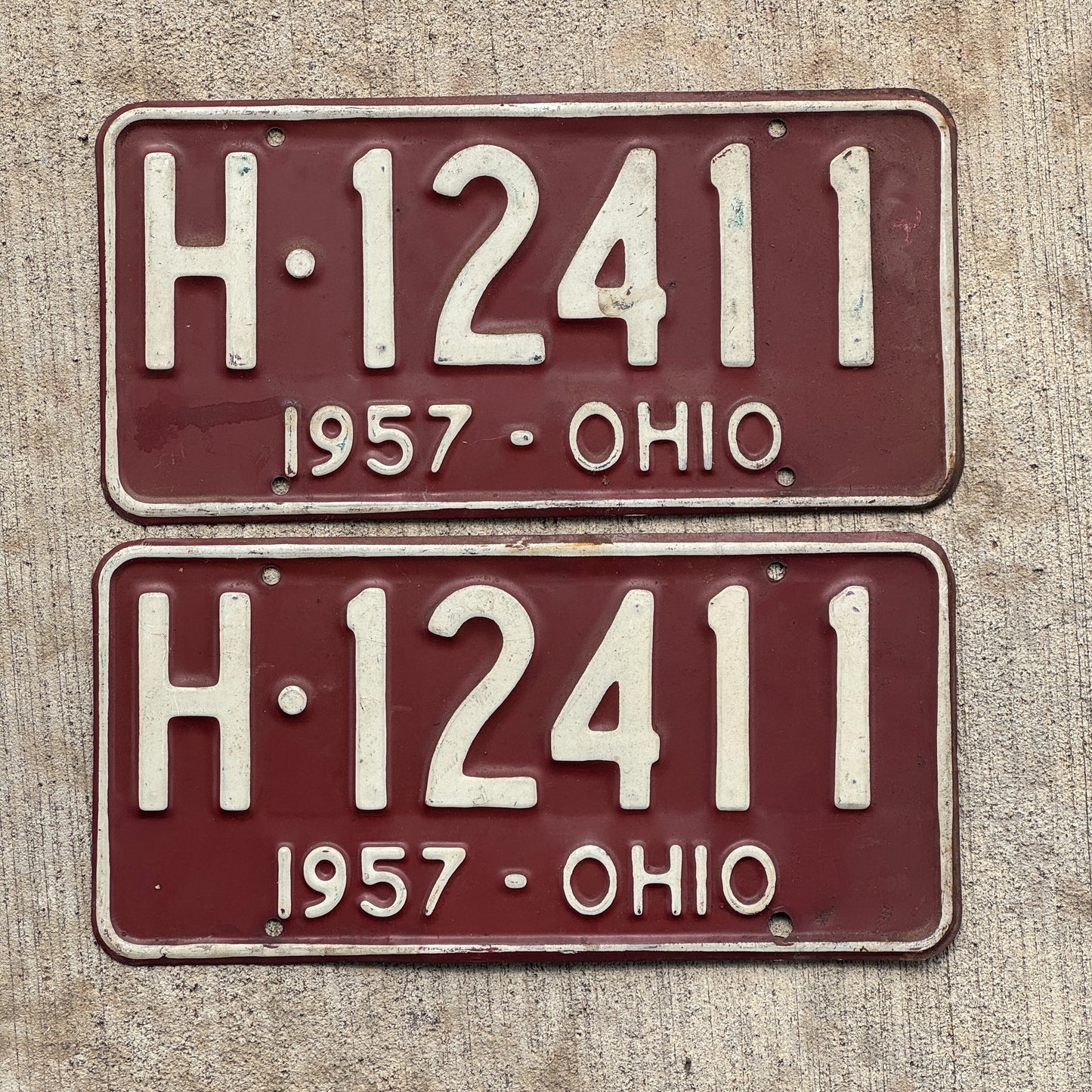 Photo of a 1957 Ohio License Plate Pair Auto Tag Garage Decor Vintage H 12411 with original patina