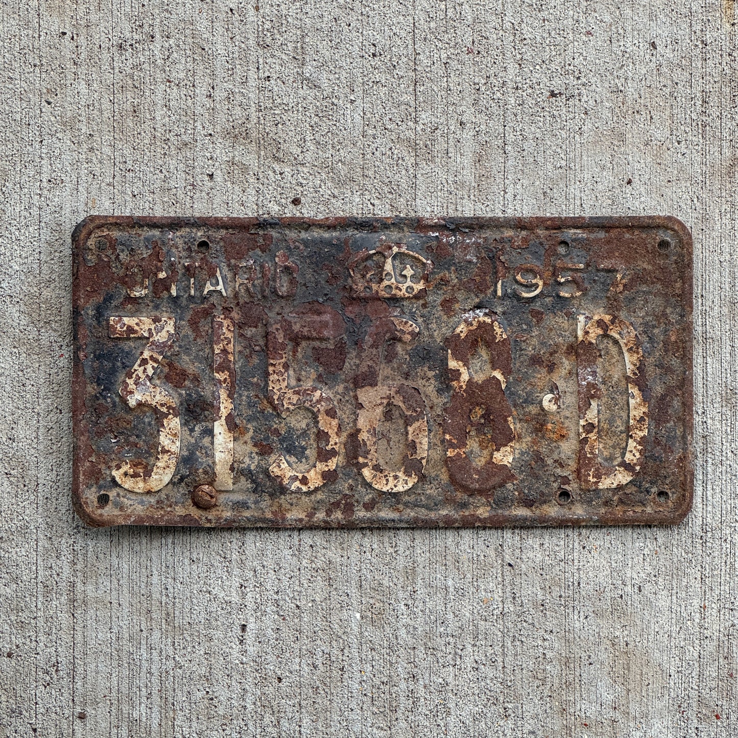 Photo of a 1957 Ontario Commercial License Plate Auto Tag Garage Decor Vintage 31568 D with original patina