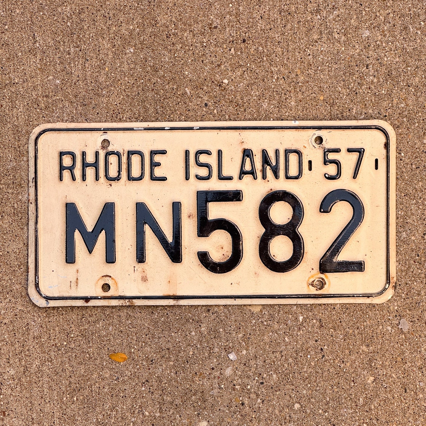 Photo of a 1957 Rhode Island License Plate Auto Tag Garage Decor Vintage MN 582 with original patina