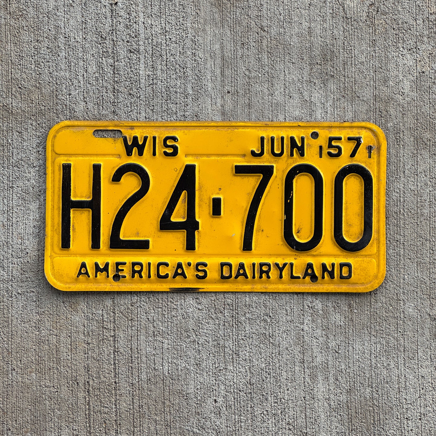 Photo of a 1957 Wisconsin License Plate Auto Tag Garage Decor Vintage H24 700 with original patina