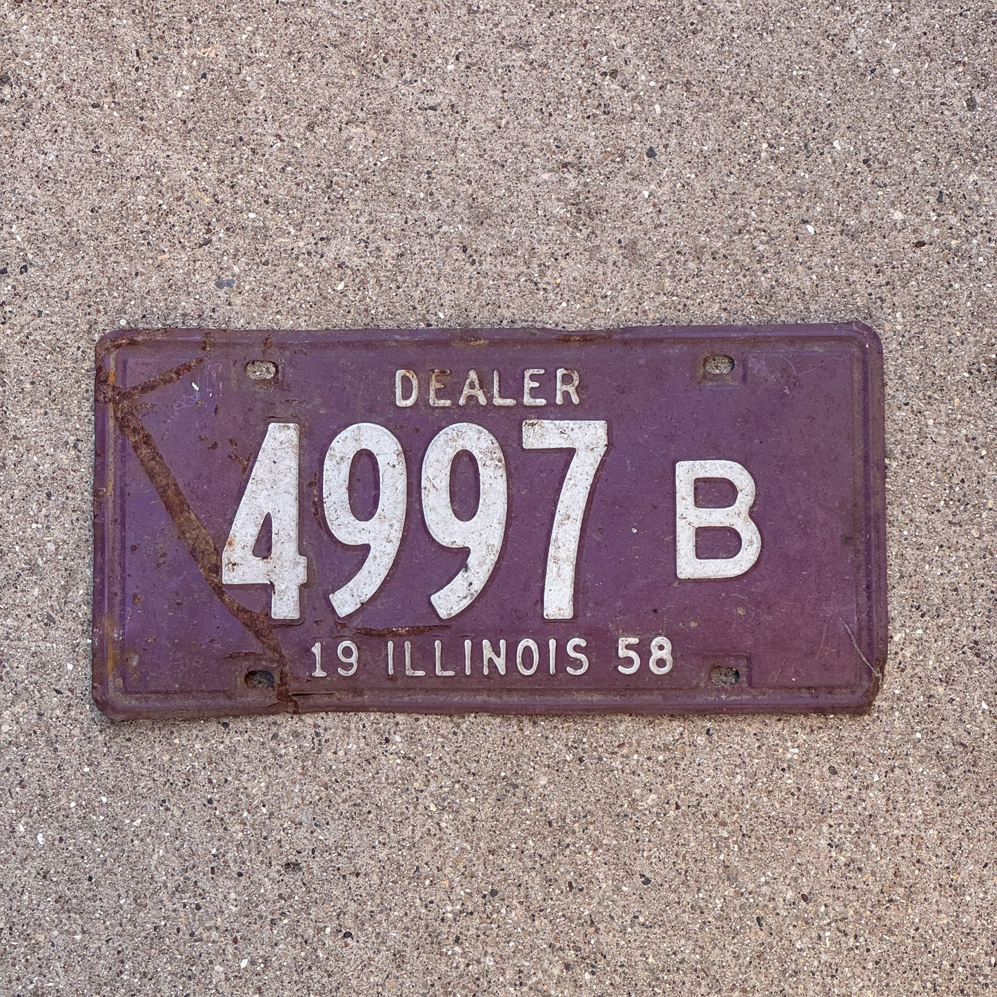 Photo of a 1958 Illinois Dealer License Plate Auto Tag Garage Decor Vintage 4997 B with original patina
