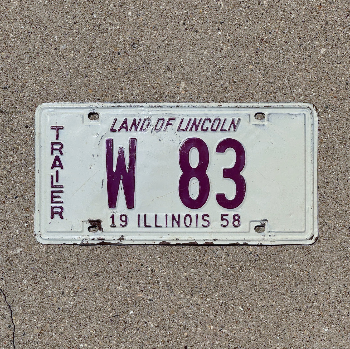 Photo of a 1958 Illinois Trailer License Plate Auto Tag Garage Decor Vintage Low Number Two Digit W 83 with original patina