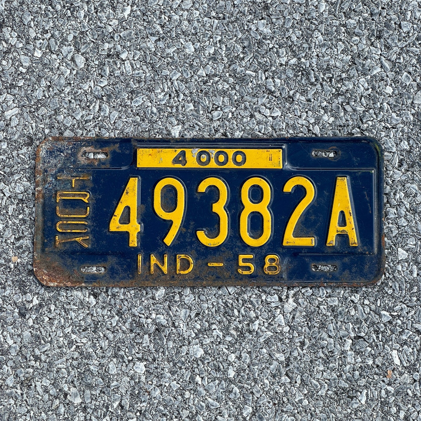 Photo of a 1958 Indiana Truck License Plate Auto Tag Garage Decor Vintage 49382A