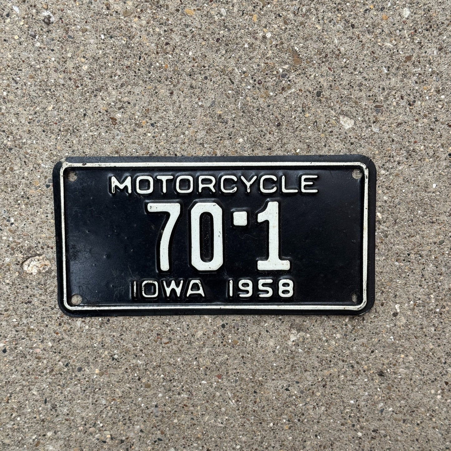 Photo of a 1958 Iowa Motorcycle License Plate Auto Tag Garage Decor Vintage Low Number Single Digit Muscatine County 70 1 with original patina