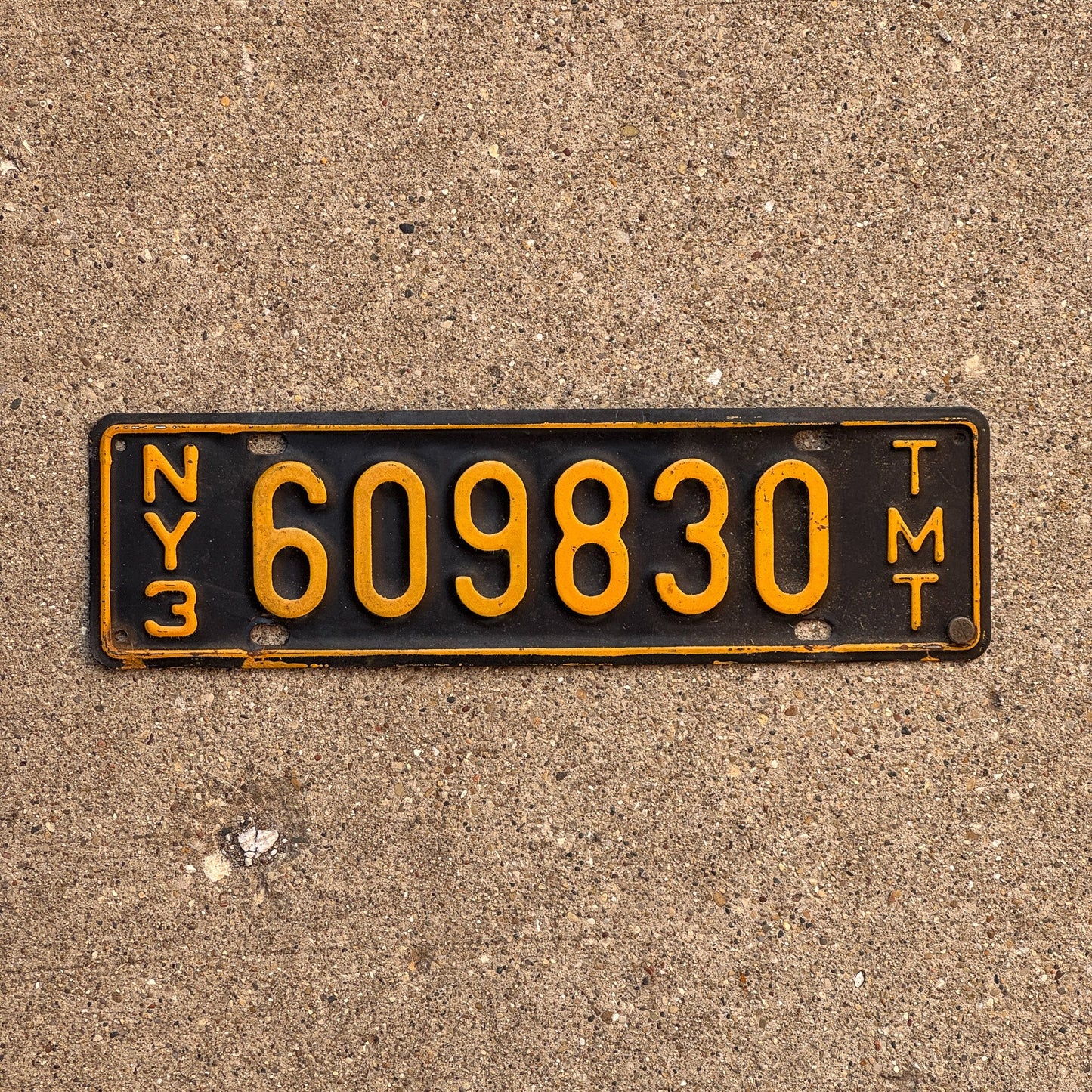 Photo of a 1958 New York Truck Mile Tax License Plate Auto Tag Garage Decor Vintage Series 3 609830 TMT