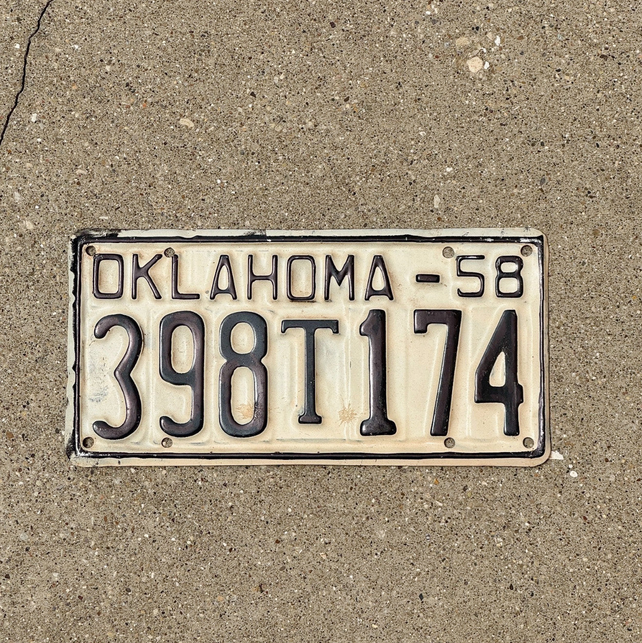 Photo of a 1958 Oklahoma Truck License Plate Auto Tag Garage Decor Vintage 398 T 174 with original patina