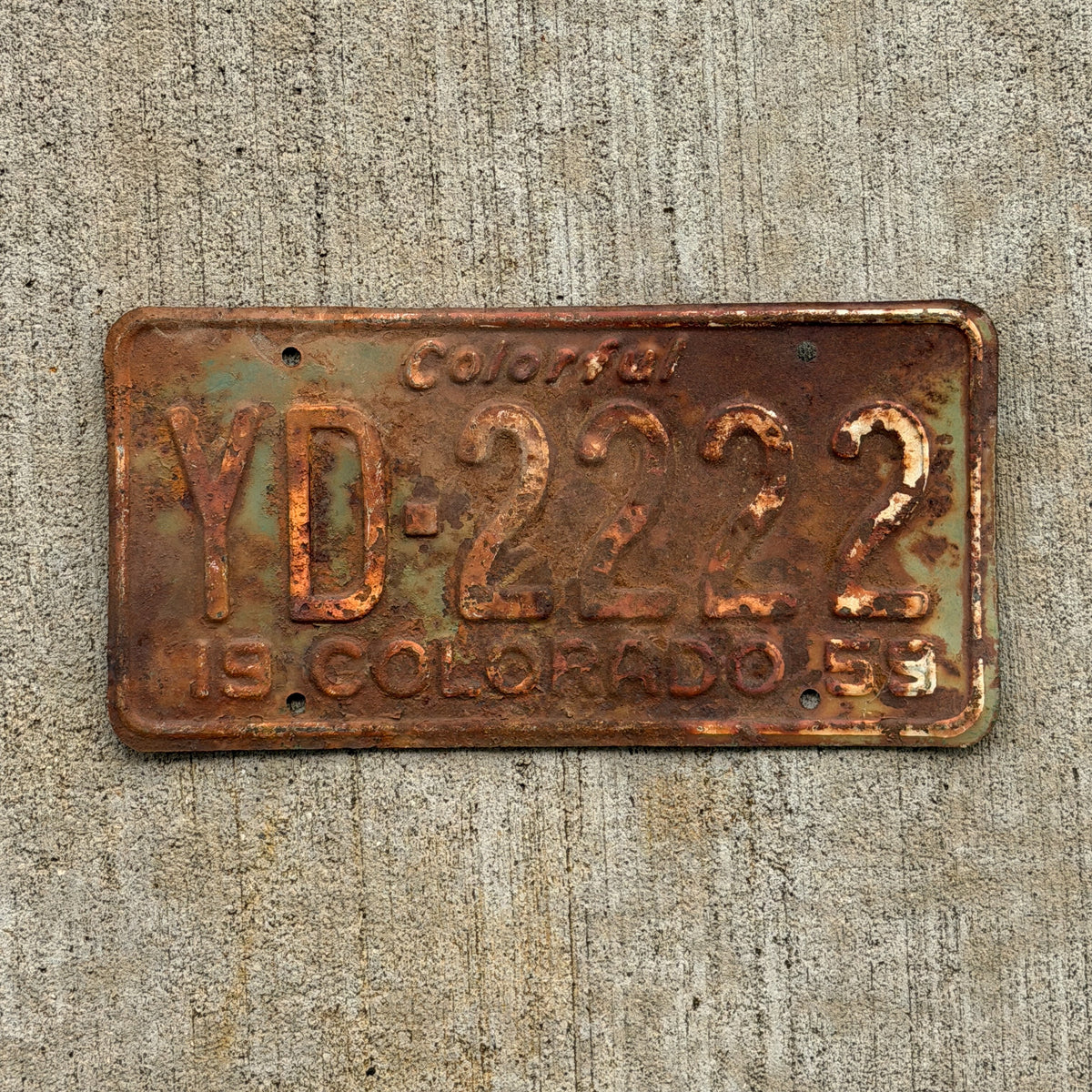 Photo of a 1959 Colorado License Plate Auto Tag Garage Decor Vintage Repeat Repeating YD 2222 with original patina