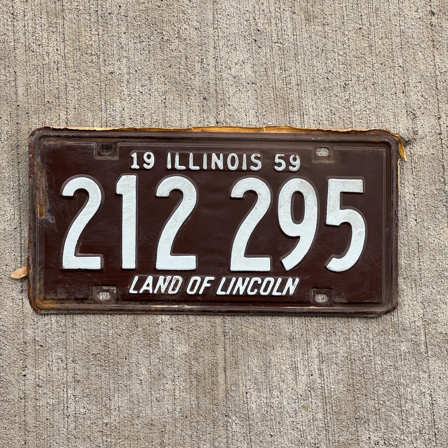 Photo of a 1959 Illinois License Plate Auto Tag Garage Decor Vintage 212 295 with original patina