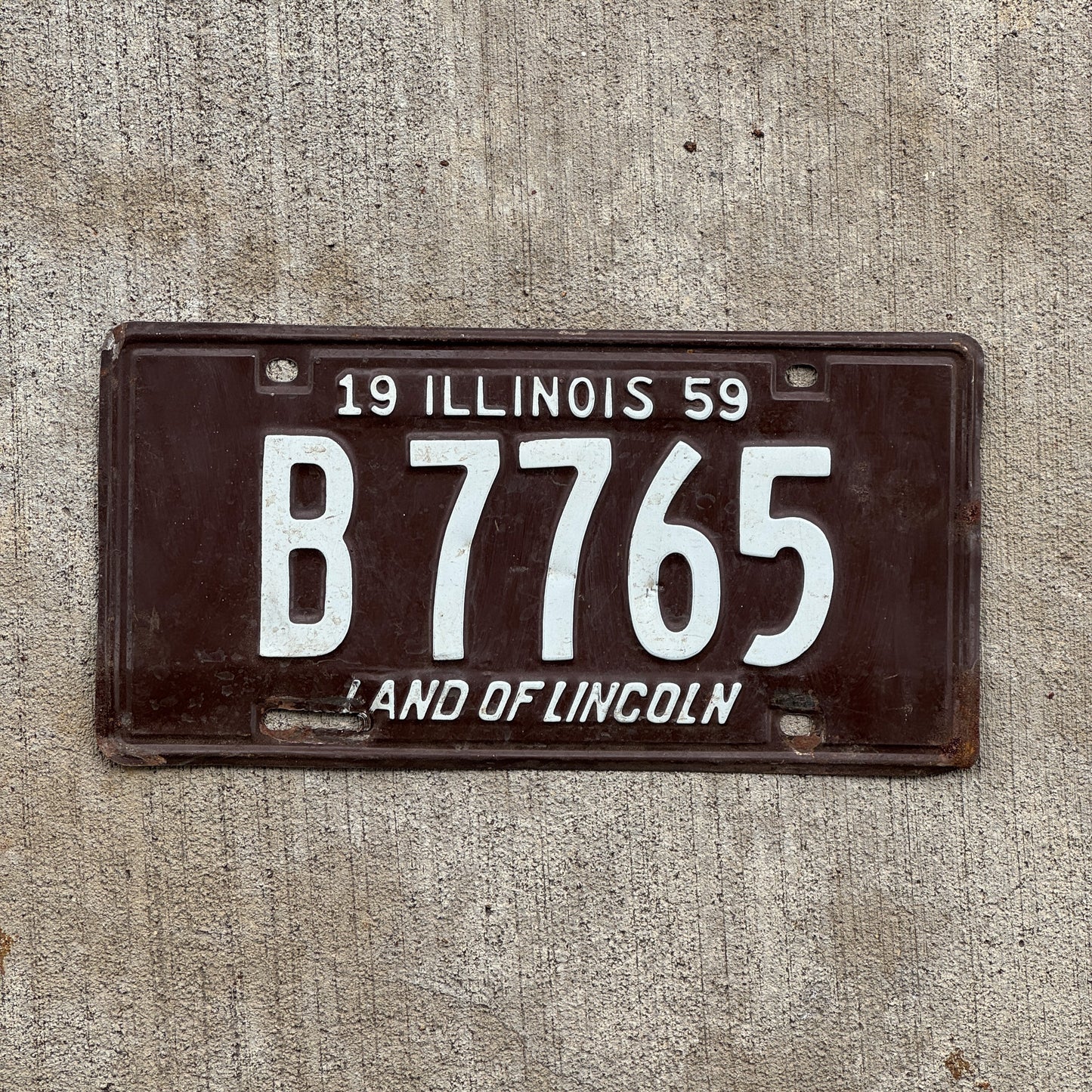 Photo of a 1959 Illinois Truck License Plate Auto Tag 2 Vintage Garage B 7765 with original patina