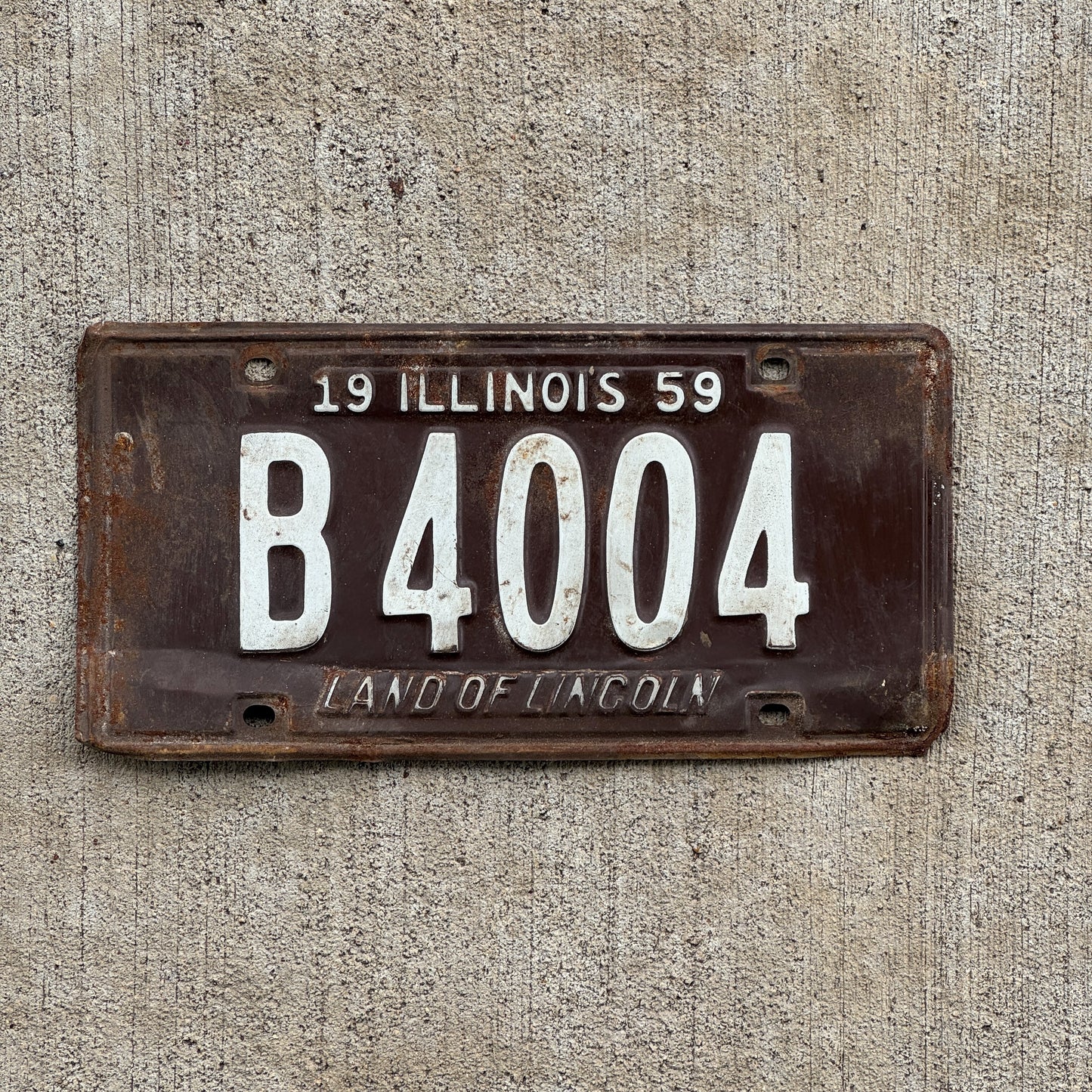 Photo of a 1959 Illinois Truck License Plate Auto Tag Garage Decor Vintage B 4004 with original patina