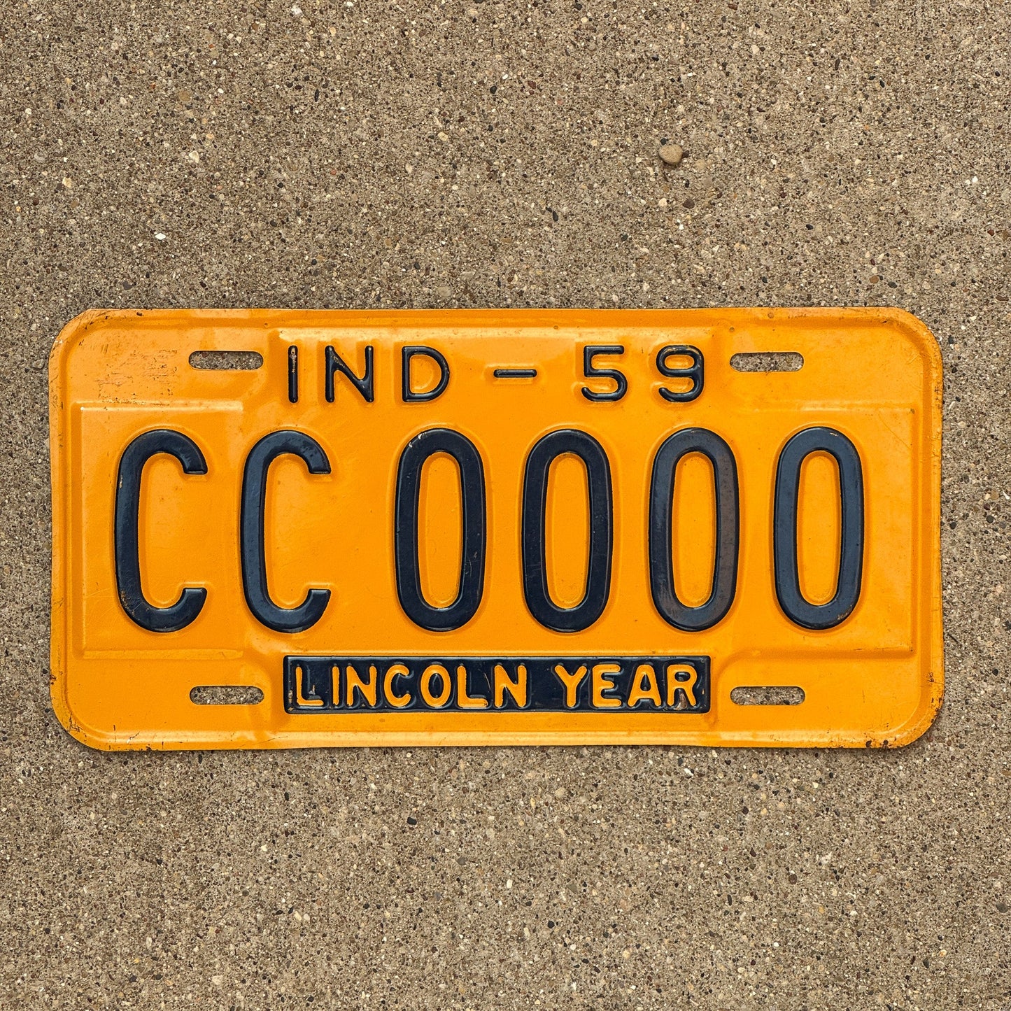 Photo of a 1959 Indiana Sample License Plate Auto Tag Garage Decor Vintage CC 0000 with original patina