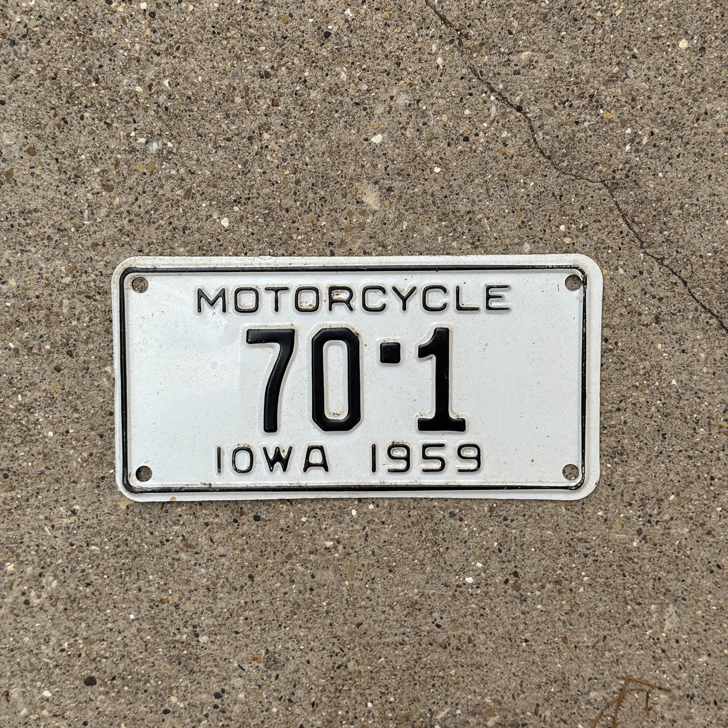 Photo of a 1959 Iowa Motorcycle License Plate Auto Tag Garage Decor Vintage Low Number Single Digit Muscatine County 70 1 with original patina