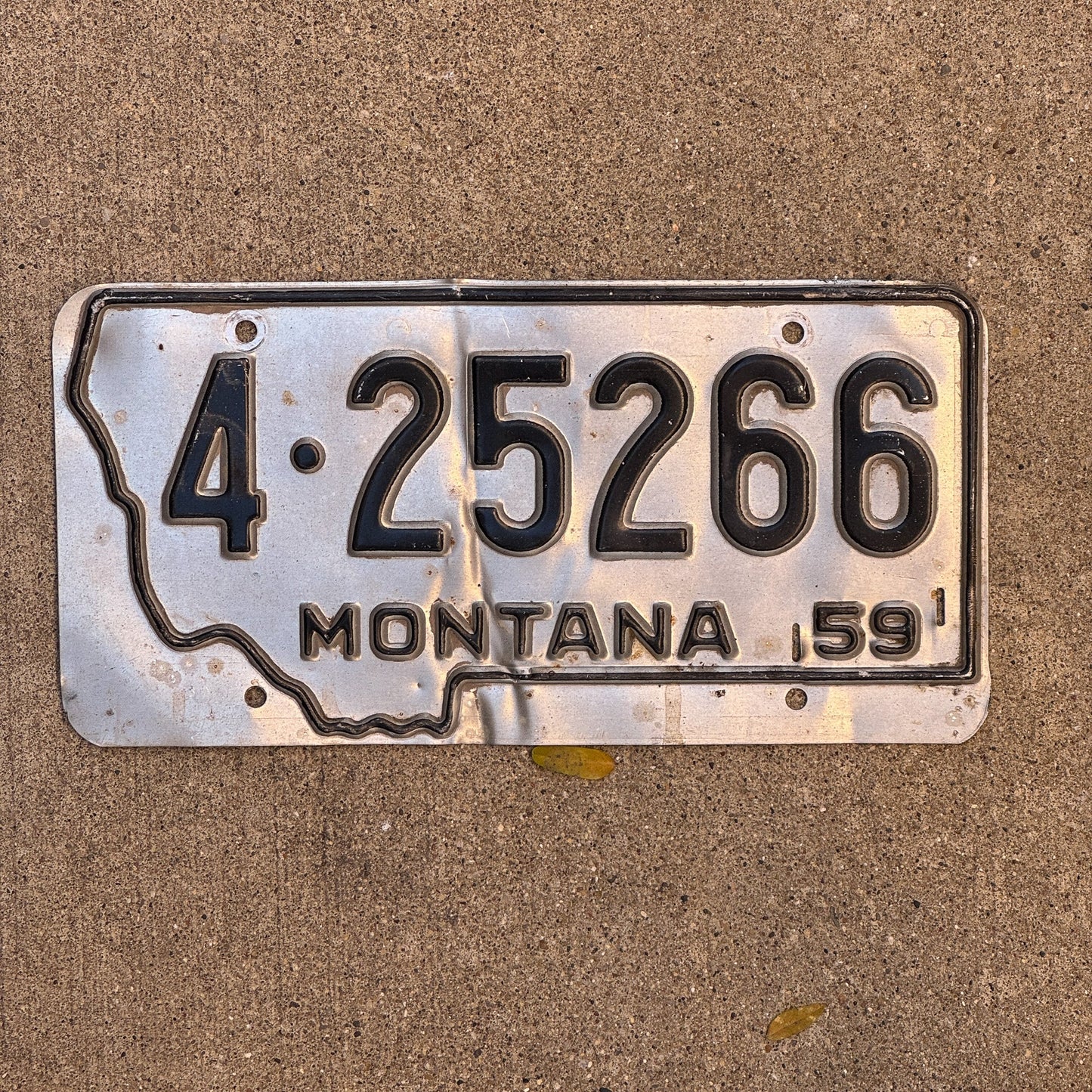 Photo of a 1959 Montana License Plate Auto Tag Garage Decor Vintage State Shape Missoula County 4 25266 with original patina