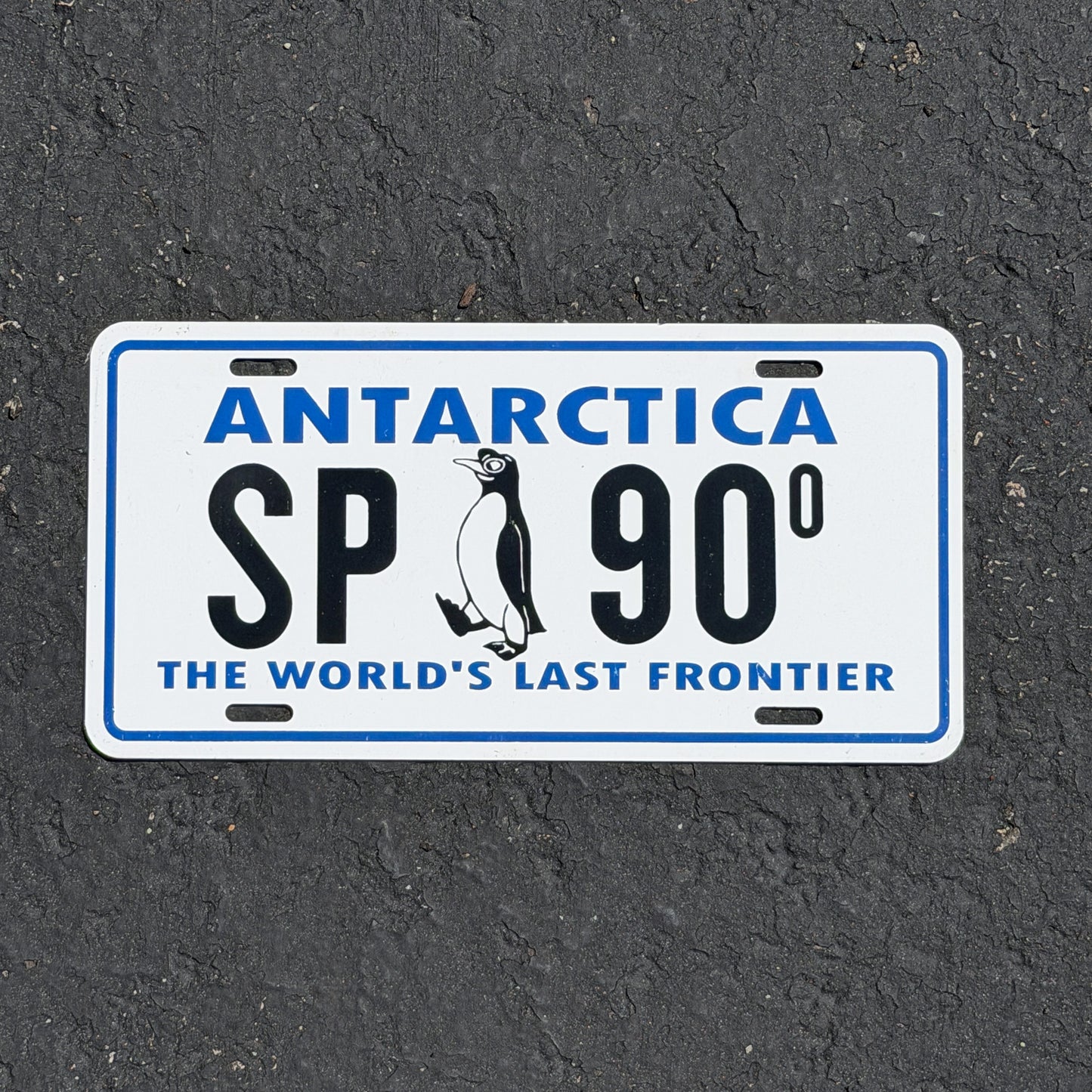 Photo of a 1960 Era Antarctica License Plate Auto Tag Garage Decor Vintage US Navy Operation Deep Freeze McMurdo Station Penguin SP 900 with original patina