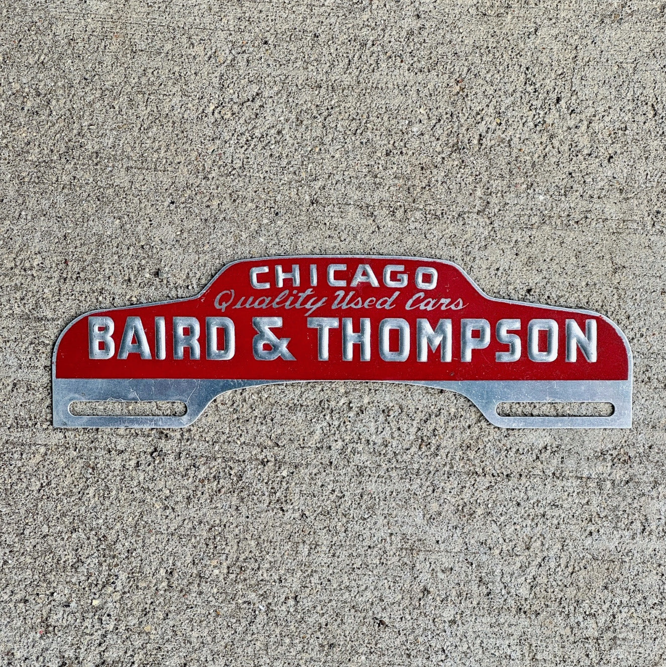 Photo of a 1960 Era Baird Thompson Chicago Illinois License Plate Topper Auto Tag Garage Decor Vintage Used Car Dealer Illinois with original patina
