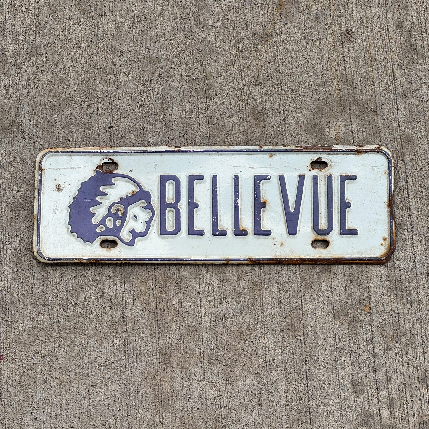 Photo of a 1960 Era Bellevue Chieftans Nebraska License Plate Topper Auto Tag Garage Decor Vintage High School with original patina