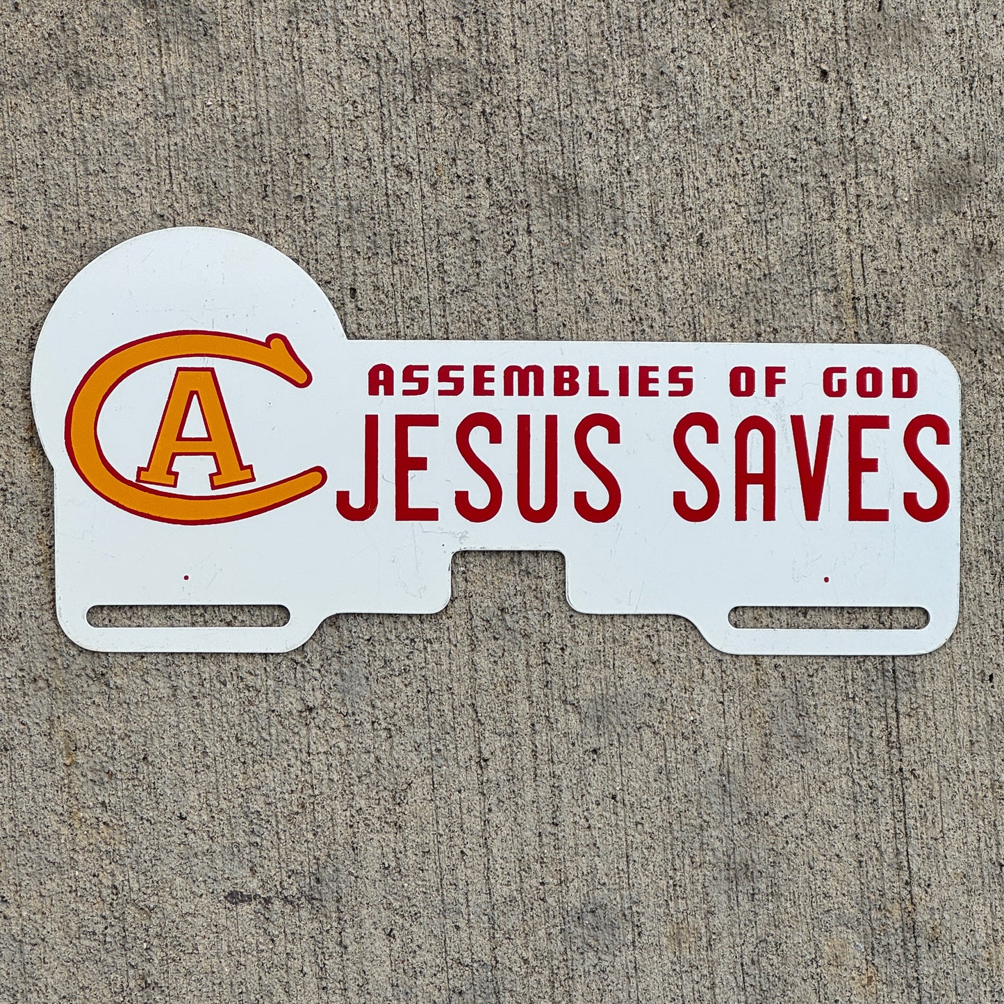 Photo of a 1960 Era Christ for All Assembies of God License Plate Topper Auto Tag Garage Decor Vintage Jesus Saves with original patina