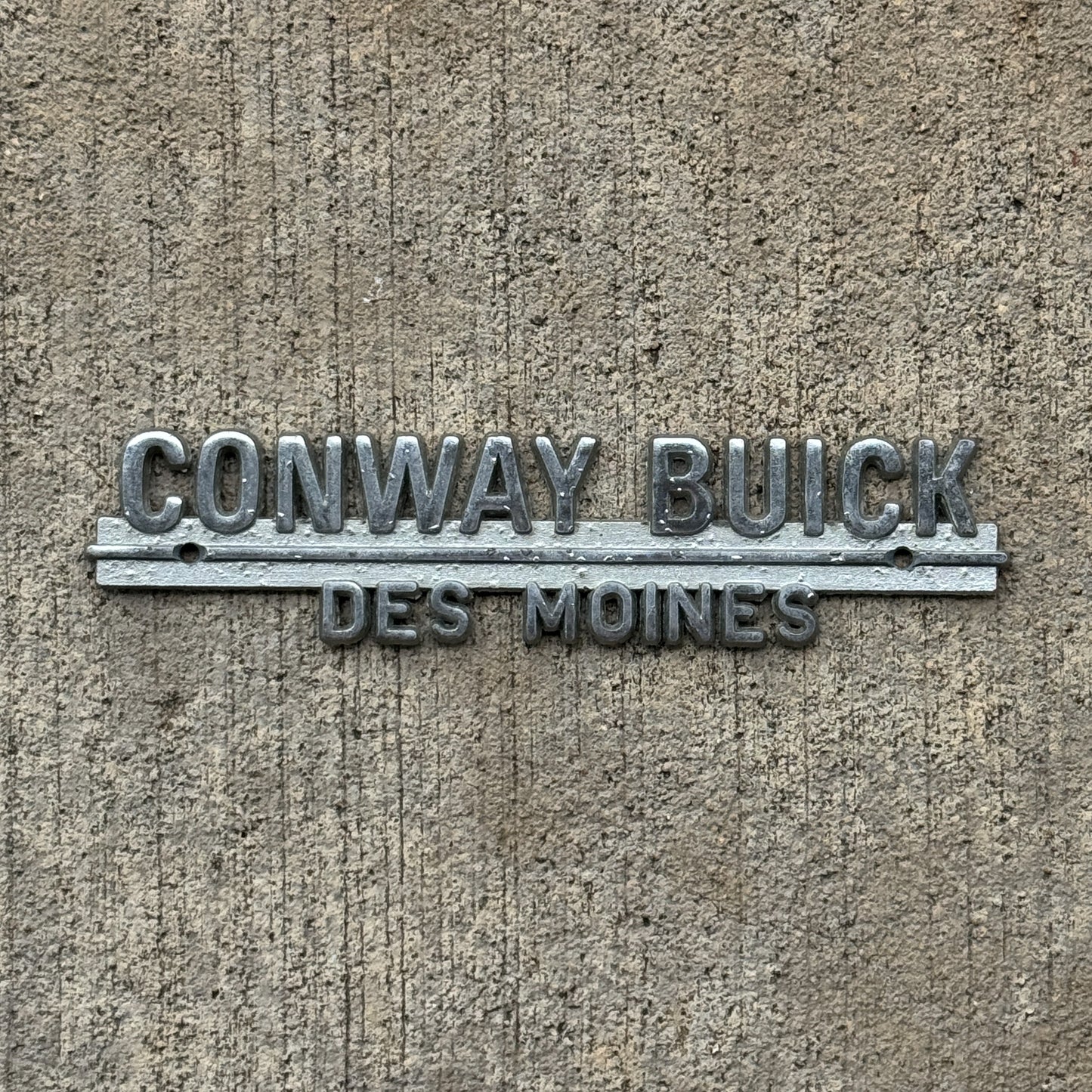 Photo of a 1960 Era Conway Buick Des Moines Iowa Dealer Badge Emblem Auto Tag Garage Decor Vintage Dealership with original patina