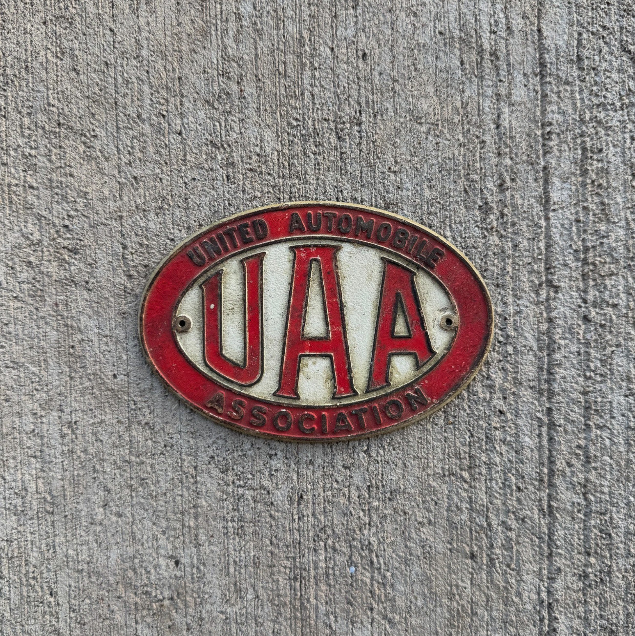 Photo of a 1960 Era License Plate Topper Auto Tag Garage Decor Vintage United Automobile Association UAA Badge Emblem