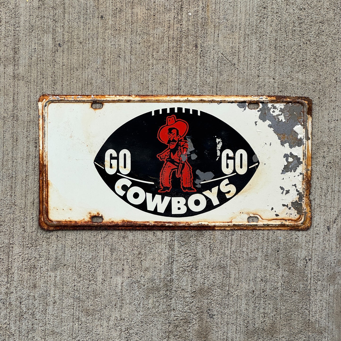 Photo of a 1960 Era Oklahoma Booster License Plate Auto Tag Garage Decor Vintage Football Metal with original patina