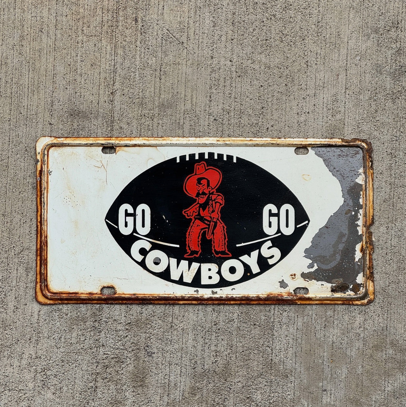 Photo of a 1960 Era University of Oklahoma Booster License Plate Auto Tag Garage Decor Vintage Football Metal with original patina