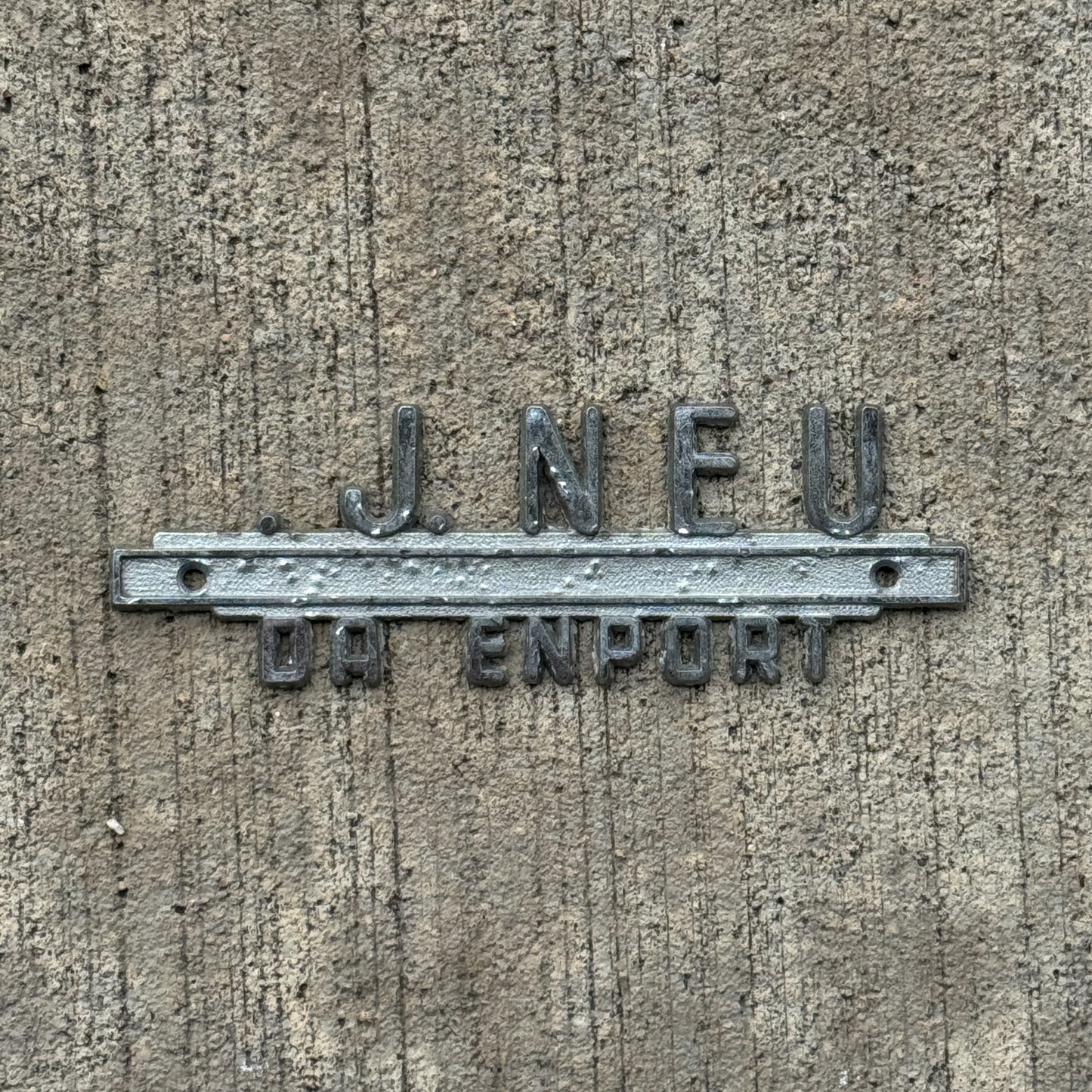 Photo of a 1960 Era VJ Neu Davenport Iowa Dealer Badge Emblem Auto Tag Garage Decor Vintage Oldsmobile Dealership with original patina