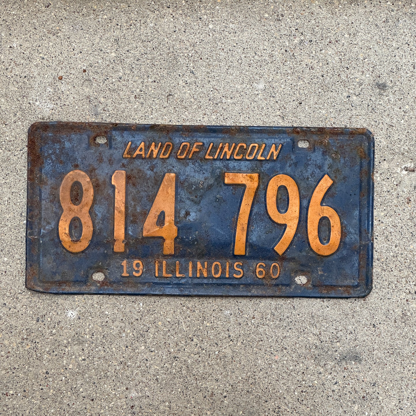 Photo of a 1960 Illinois License Plate Auto Tag 1 Vintage Garage Orange Blue 814 796 with original patina