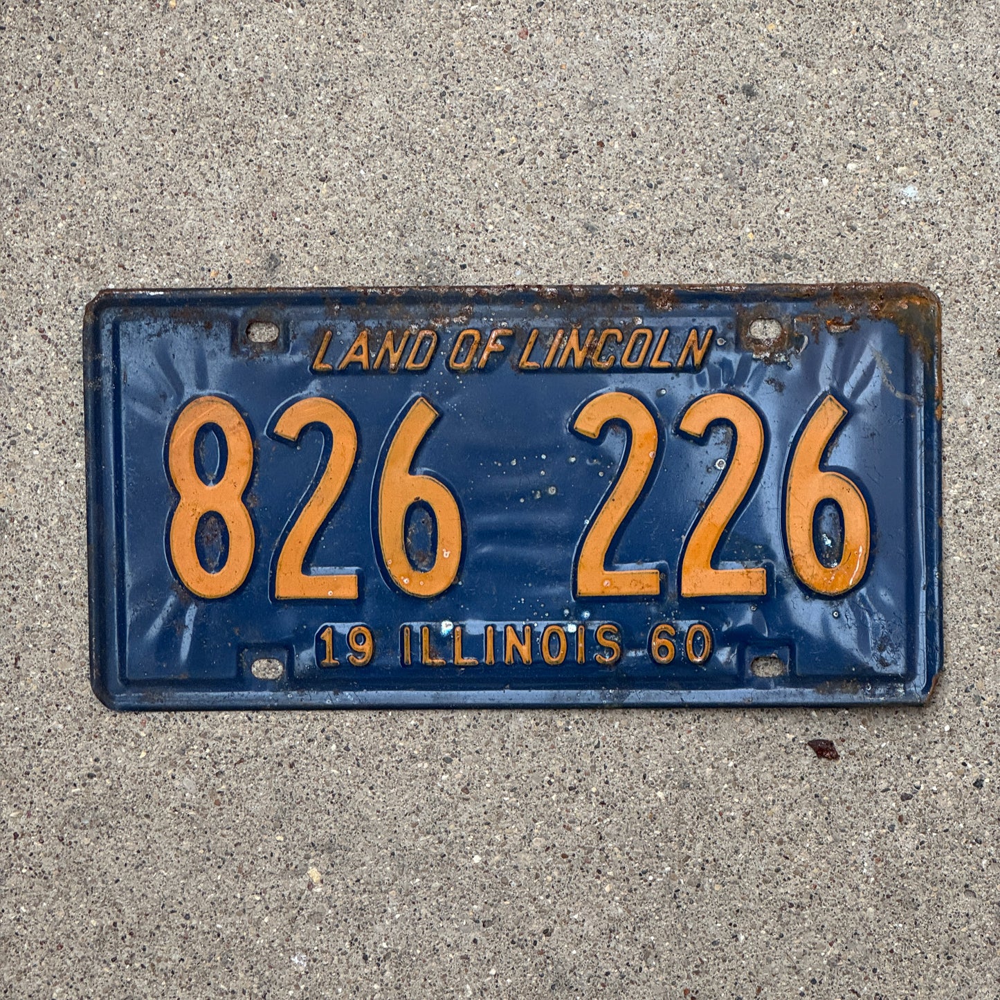 Photo of a 1960 Illinois License Plate Auto Tag 1 Vintage Garage Orange Blue 826 226 with original patina