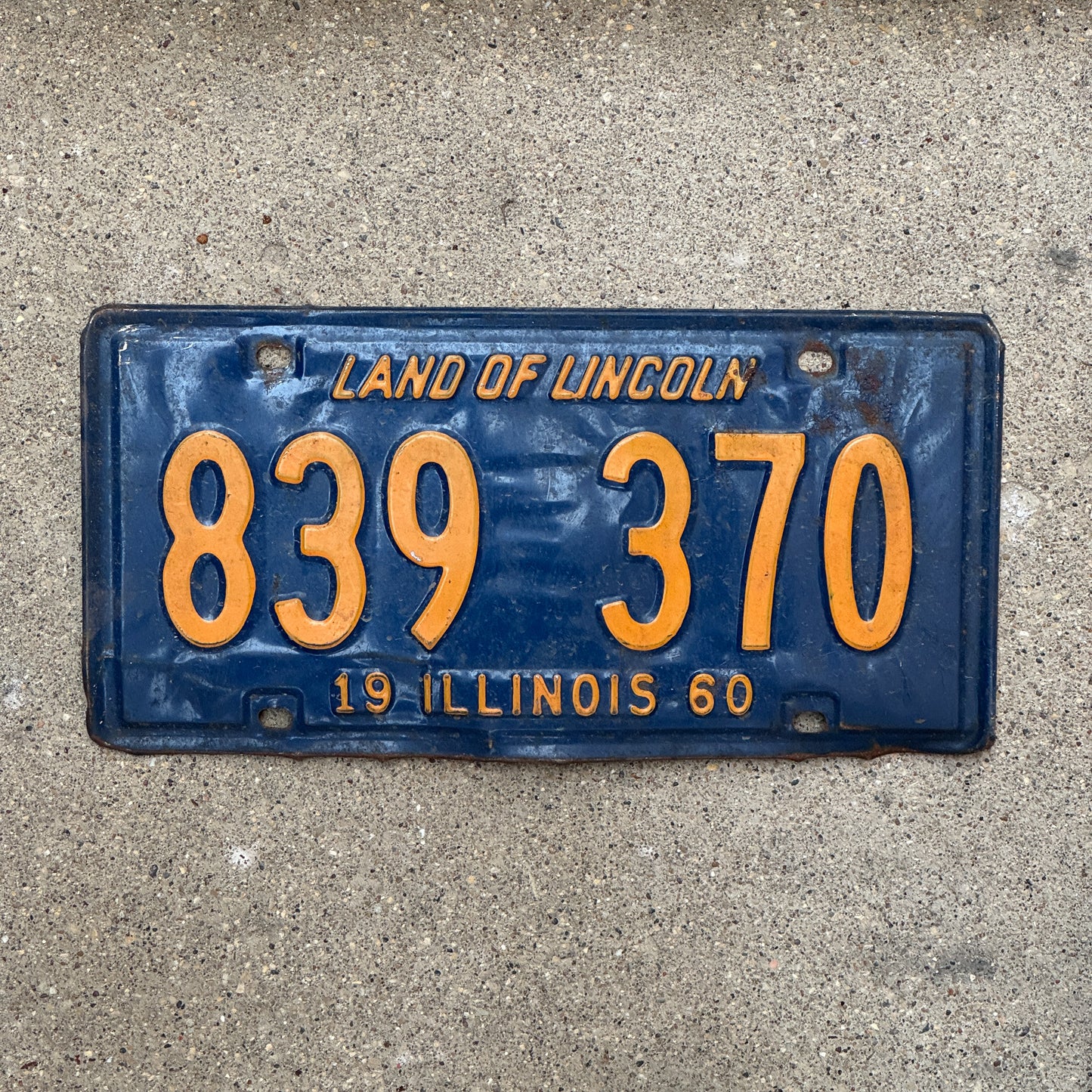 Photo of a 1960 Illinois License Plate Auto Tag 1 Vintage Garage Orange Blue 839 370 with original patina