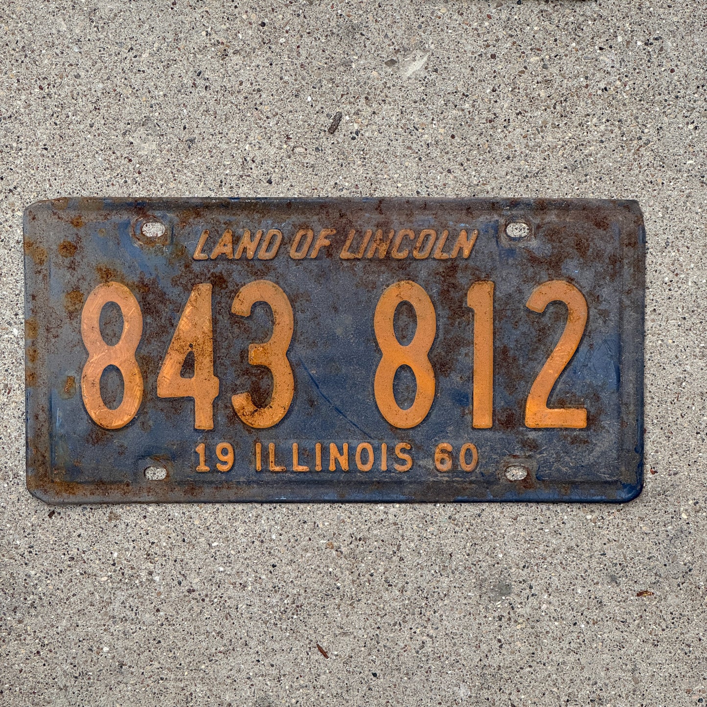 Photo of a 1960 Illinois License Plate Auto Tag 1 Vintage Garage Orange Blue 843 812 with original patina