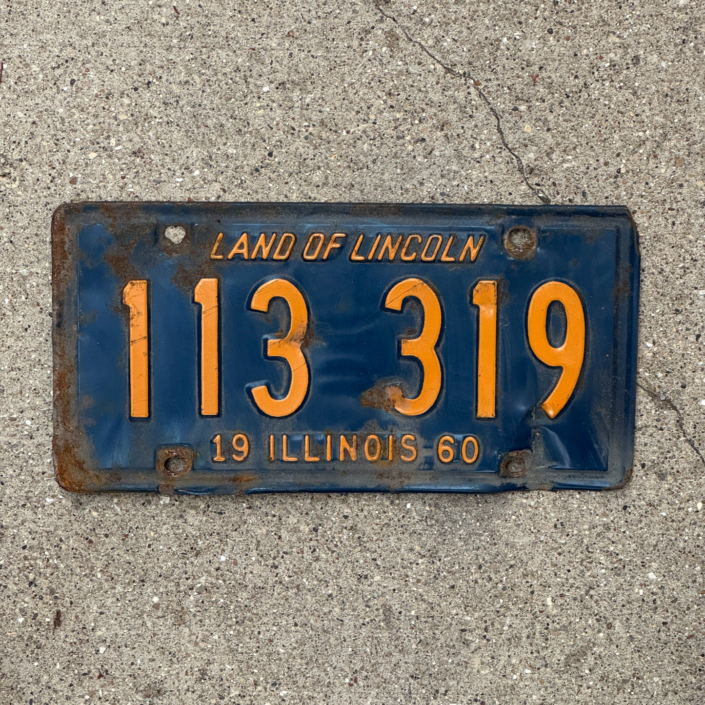 Photo of a 1960 Illinois License Plate Auto Tag 2 Vintage Garage Orange Blue 113 319 with original patina