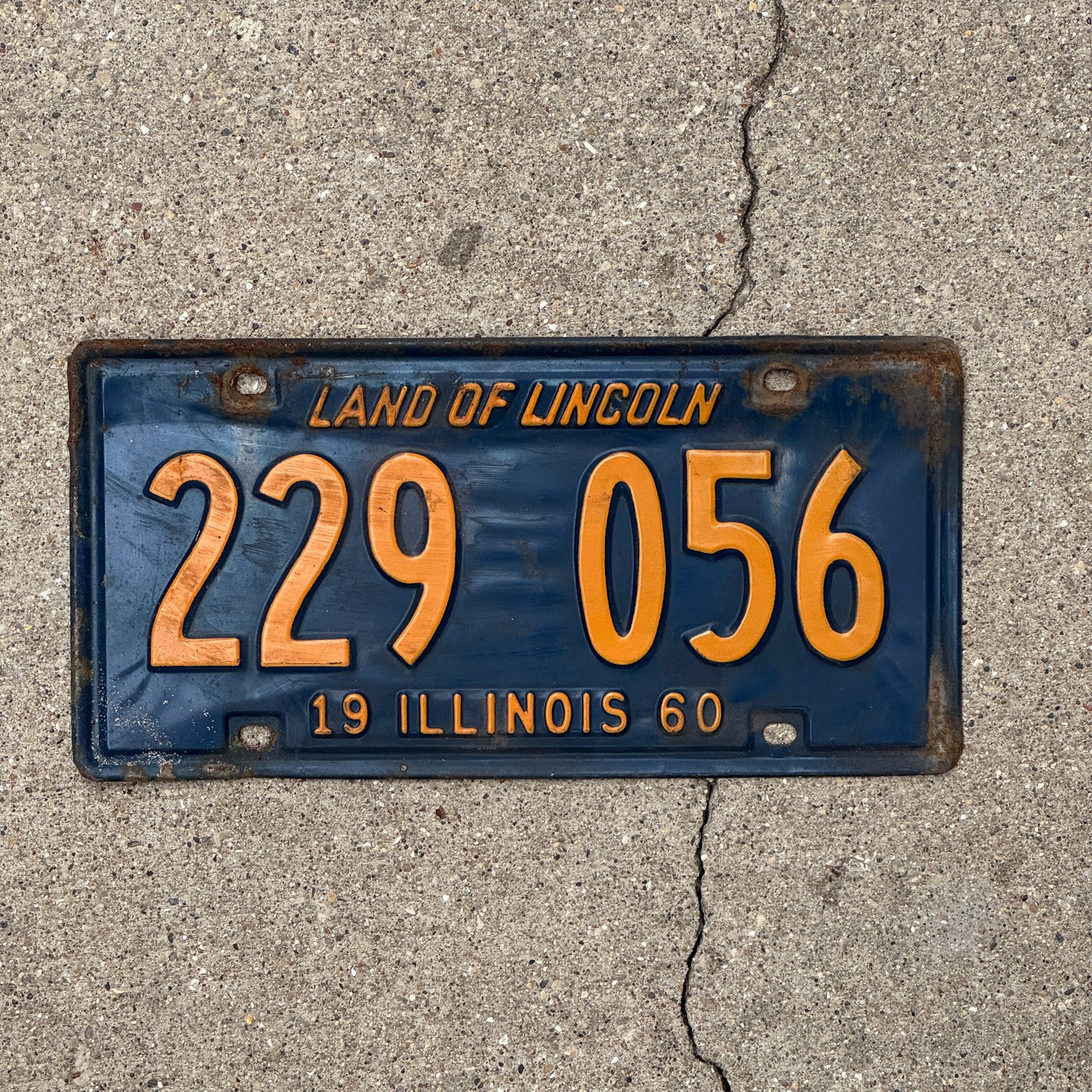 Photo of a 1960 Illinois License Plate Auto Tag 2 Vintage Garage Orange Blue 229 056 with original patina