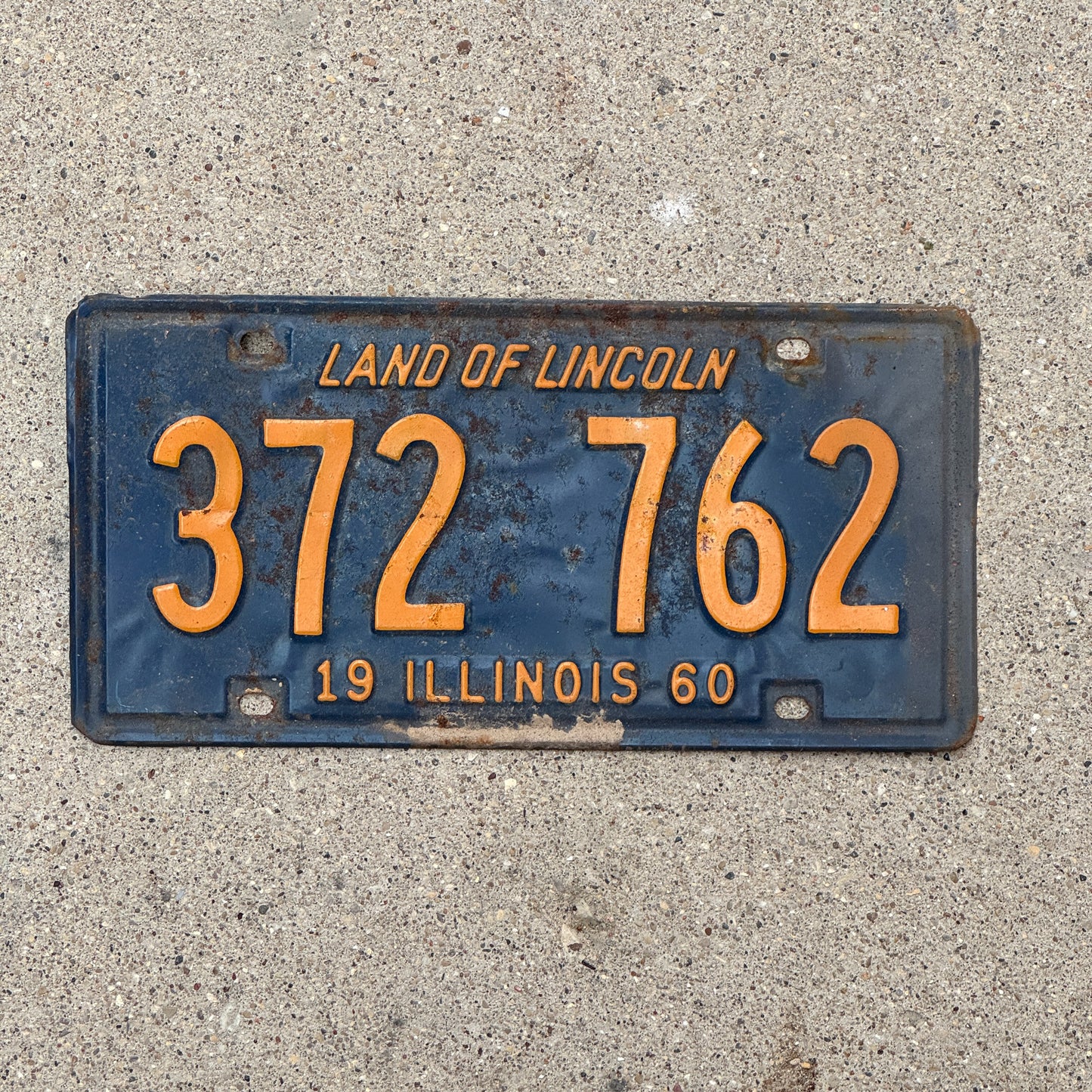 Photo of a 1960 Illinois License Plate Auto Tag 2 Vintage Garage Orange Blue 372 762 with original patina