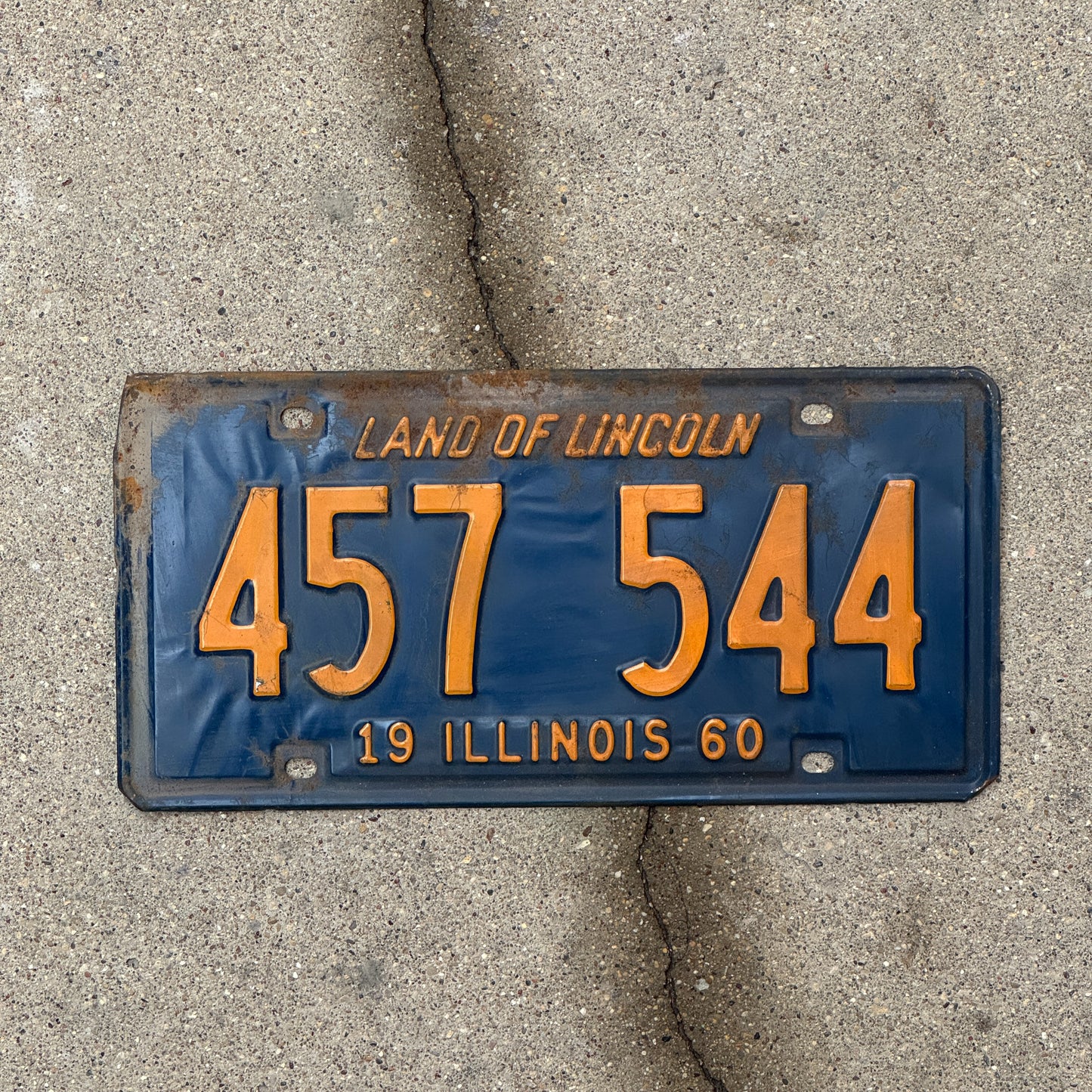 Photo of a 1960 Illinois License Plate Auto Tag 2 Vintage Garage Orange Blue 457 544 with original patina